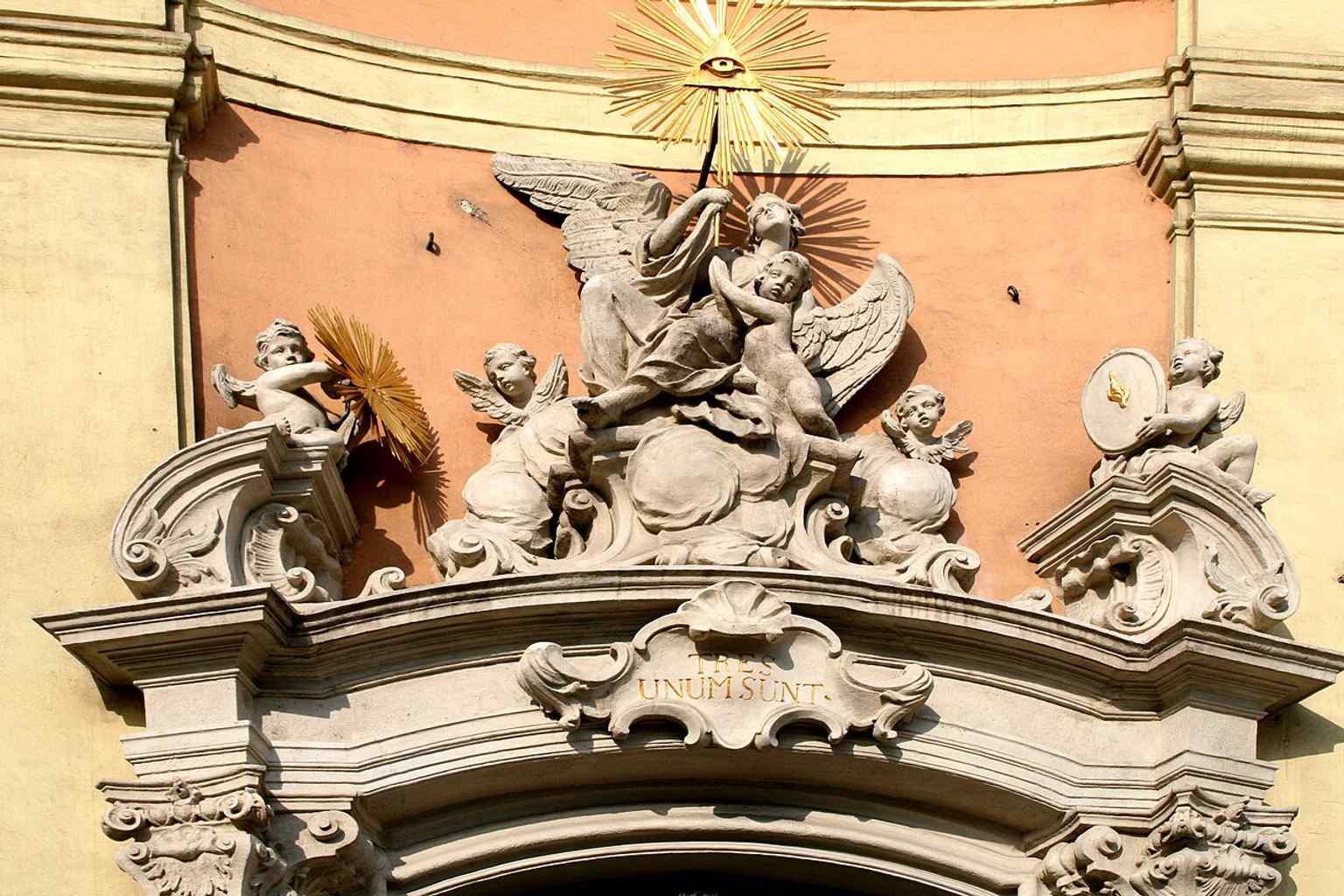A close look at the sculpted portal relief, echoing the richly carved entrance described in the church history.