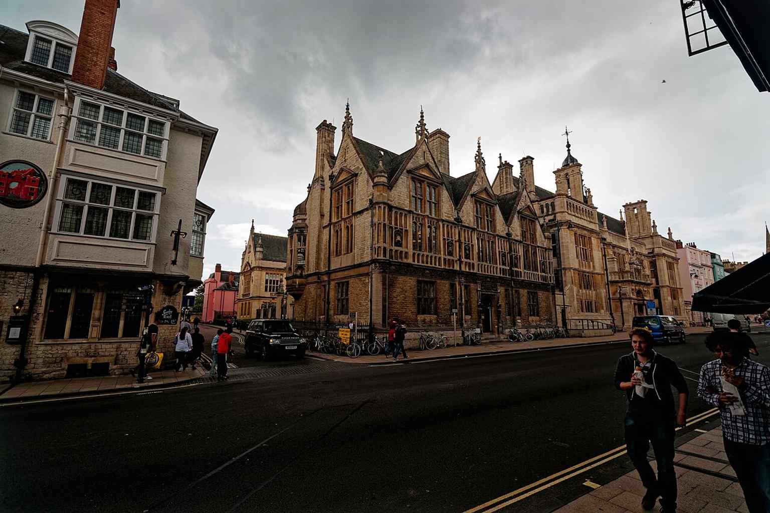 The Ruskin School of Drawing and Fine Art on Oxford High Street, shown in a historic view that places the school beside the Examination Schools and near the university centre.