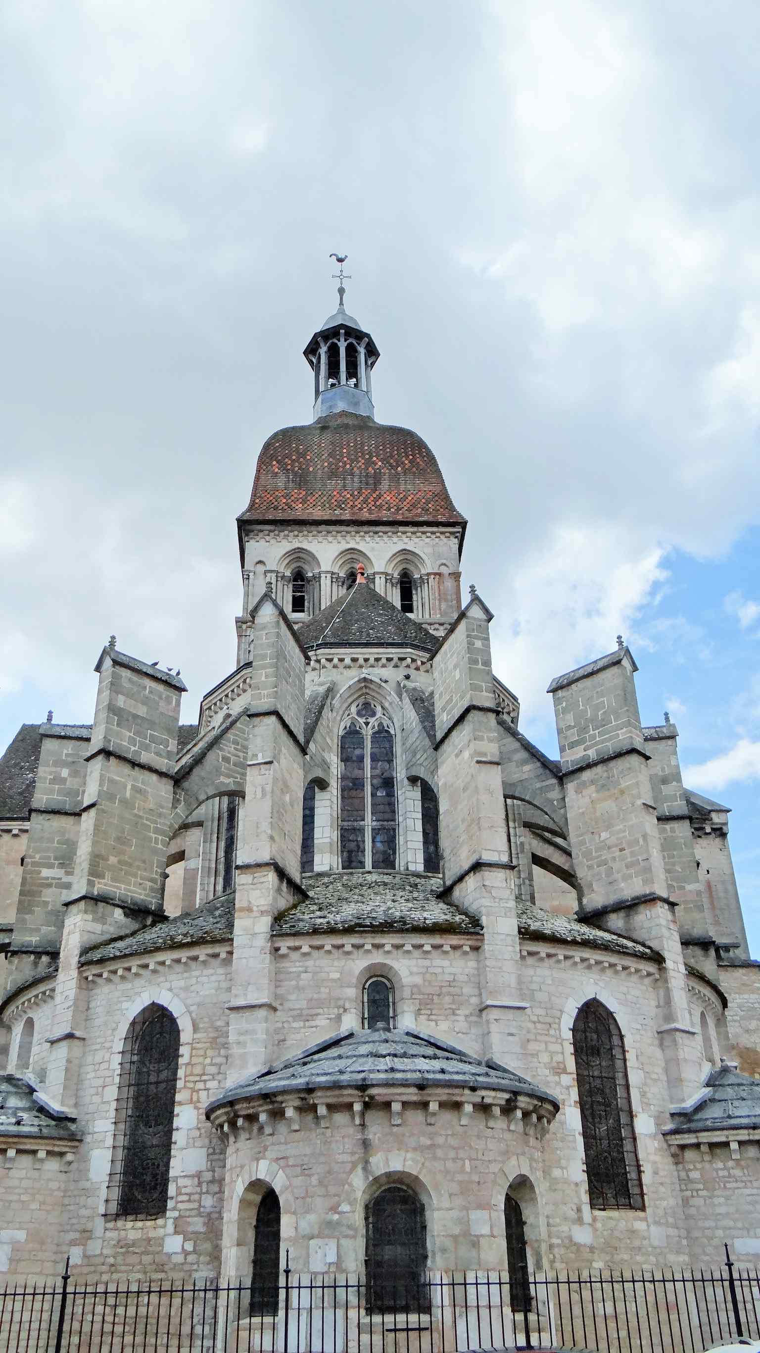 The chevet (apse) of the basilica, where original Romanesque windows were replaced by immense Gothic windows and flying buttresses were added after a fire in 1272.