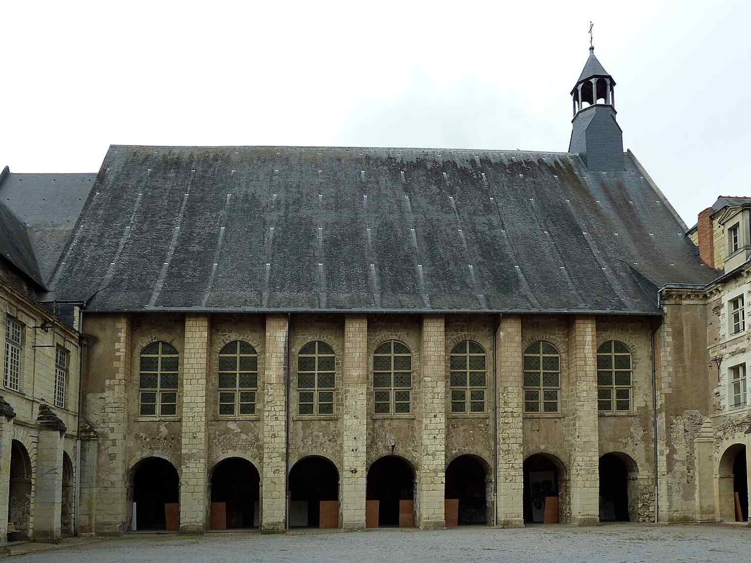 The impressive Romanesque abbatial church, visible here, was rebuilt between 1060/1070 and 1119, forming the heart of the once-opulent abbey.
