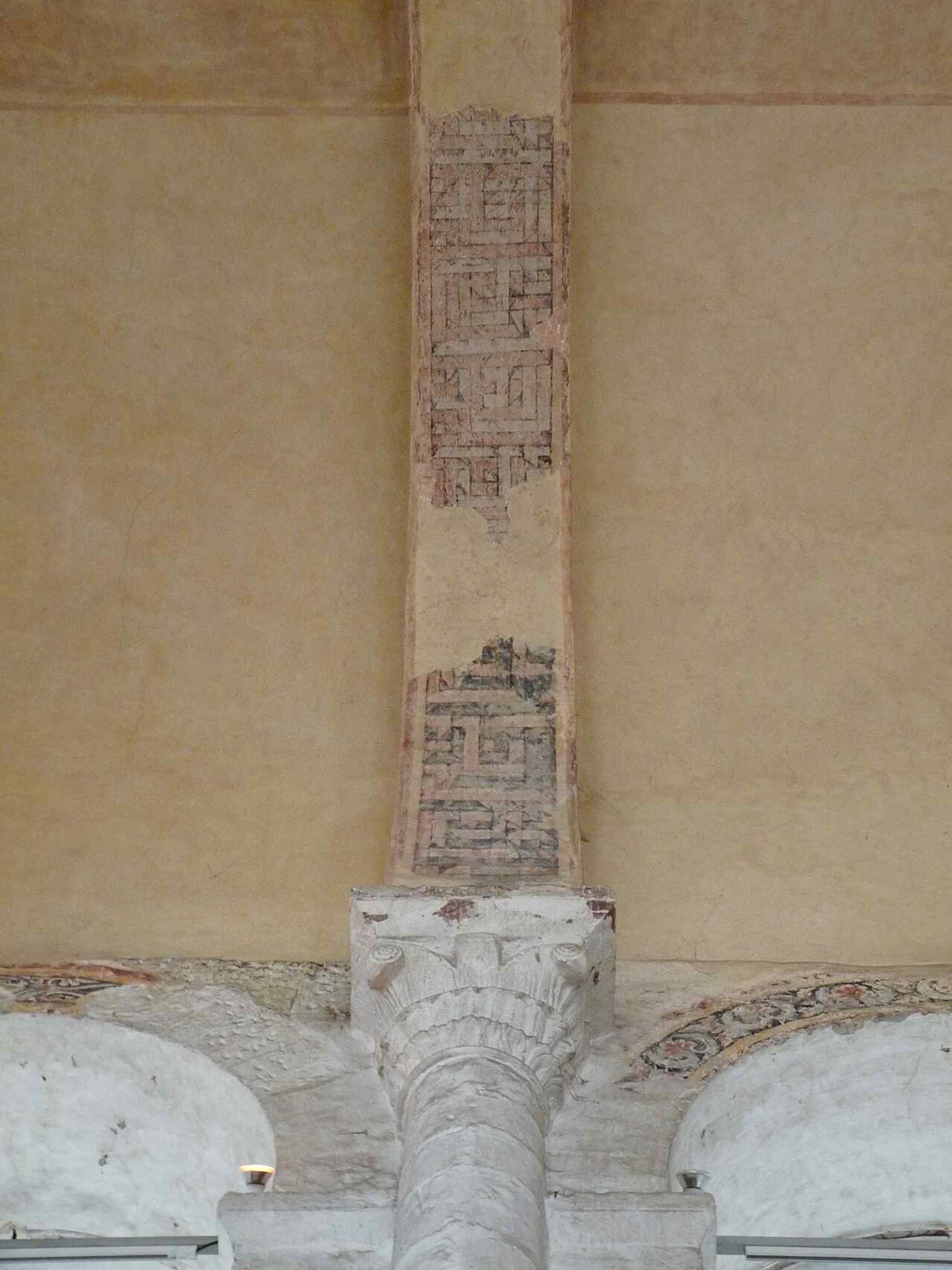 Observe the intricate carving of this Romanesque capital inside the church, showcasing the architectural detail of a building classified as a historical monument since 1840.