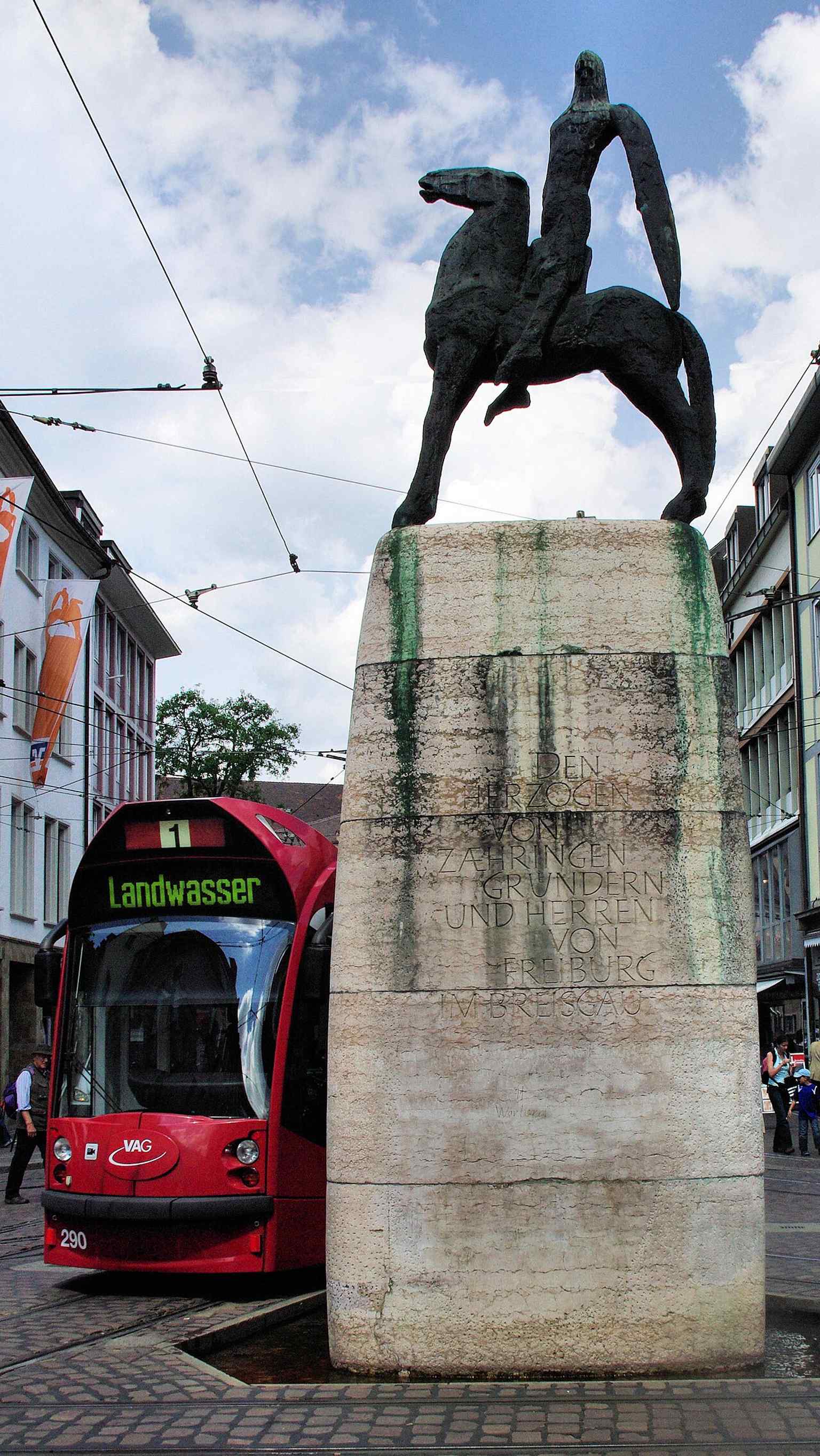 A close view of the fountain fed by the city’s famous Bächle, a detail that ties the monument to Freiburg’s water system.
