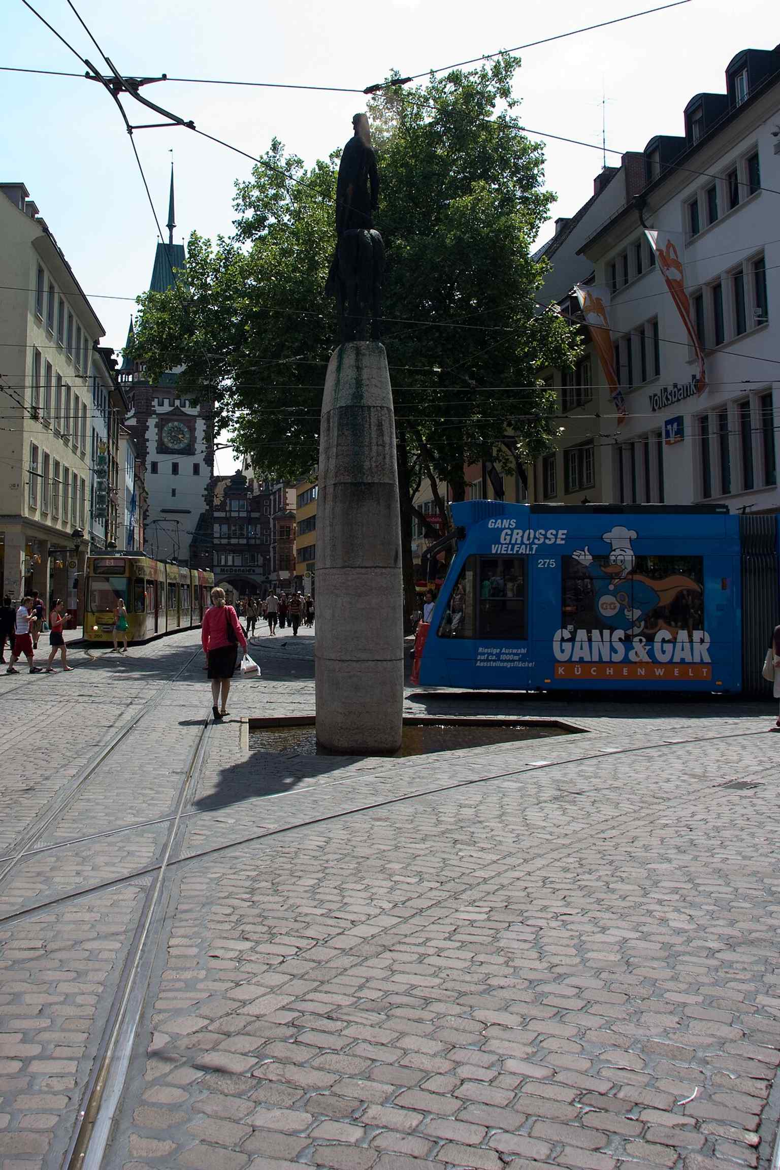 Trams passing the Bertoldsbrunnen — four of Freiburg’s five tram lines stop here, making it a true transport hub.
