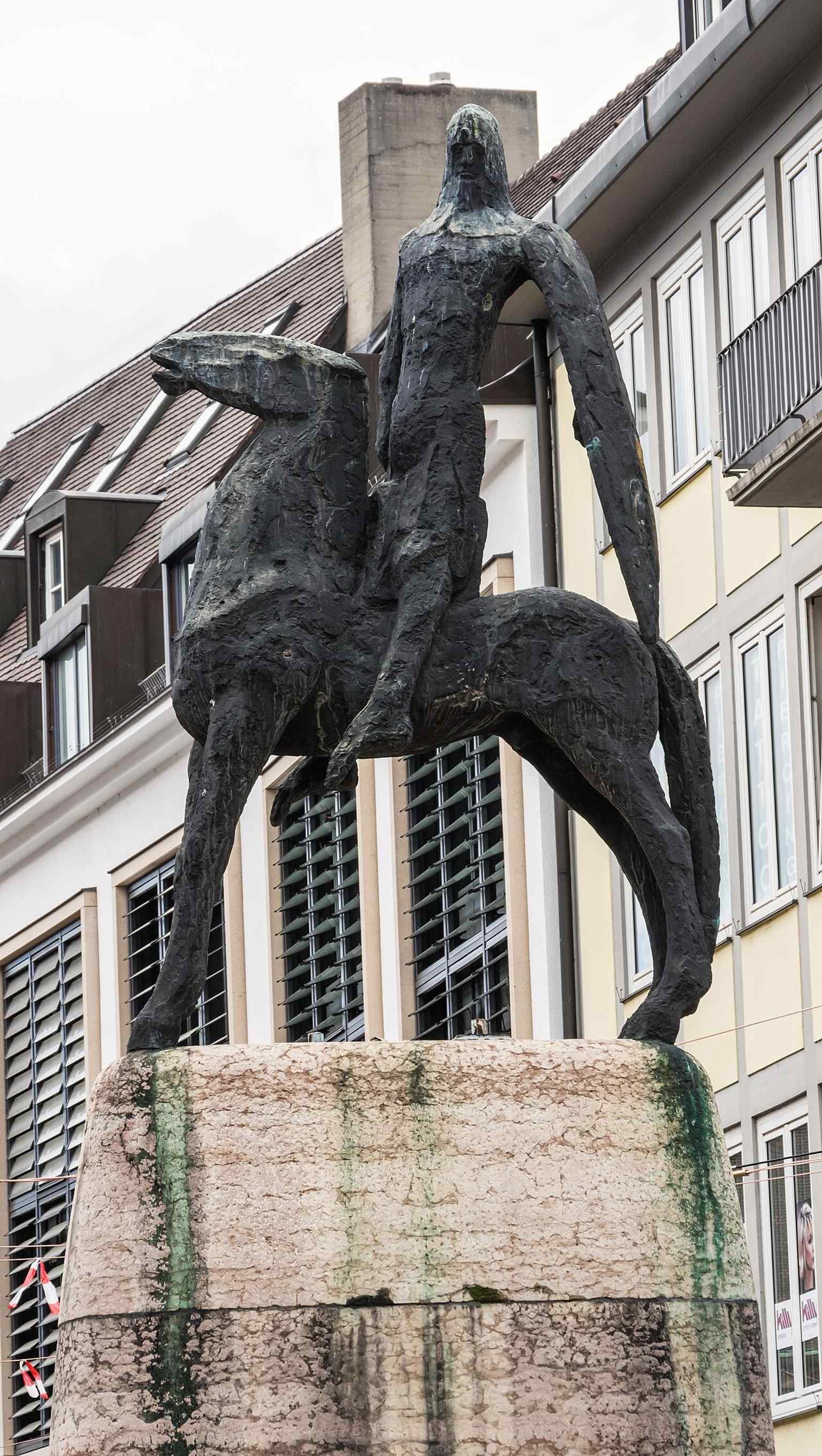 The bronze rider in a wire-free view, showing the abstract postwar figure that replaced the destroyed prewar statue.