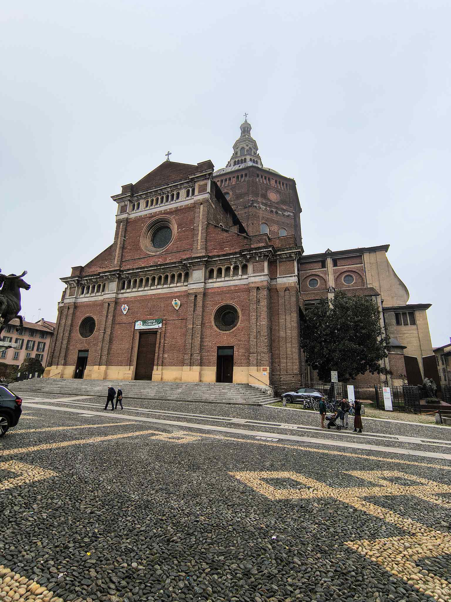 The grand facade of the Duomo, built between 1895 and 1898 by Carlo Maciachini, whose original design for the exterior was only partially completed due to chronic lack of funds.