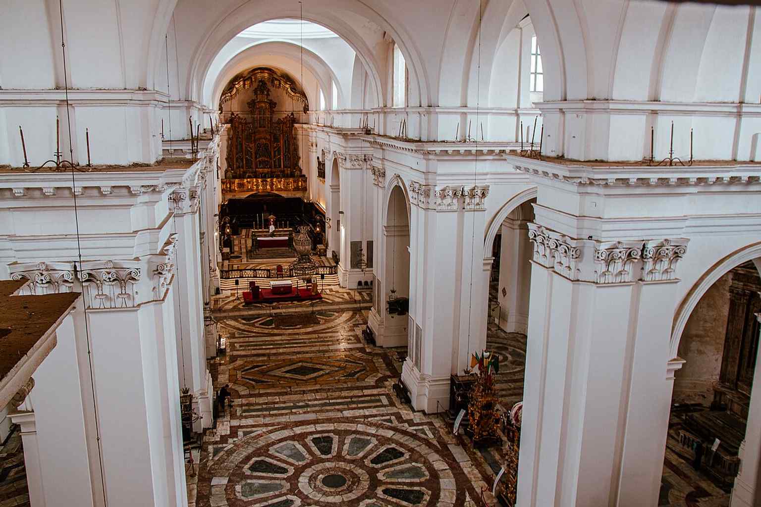 A wider exterior view that emphasizes the monumental scale of the largest church in Sicily, rebuilt after the 1669 Etna eruption.