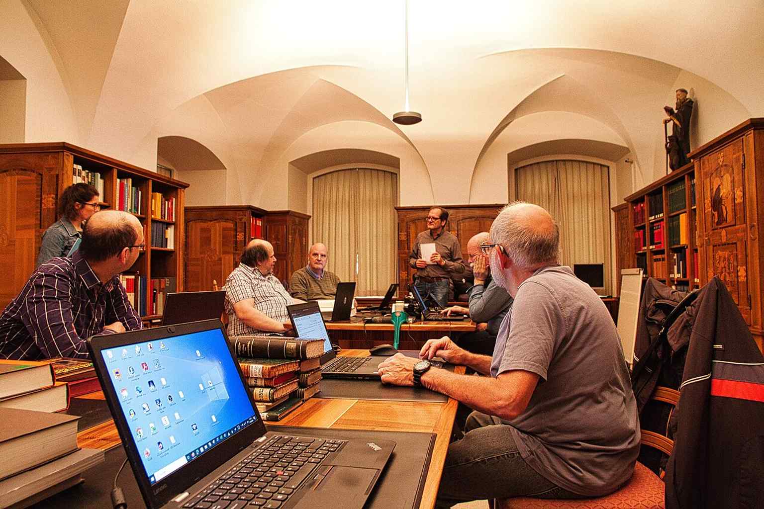 Visitors briefing in the reading room, showing the library still functioning as a living research space.