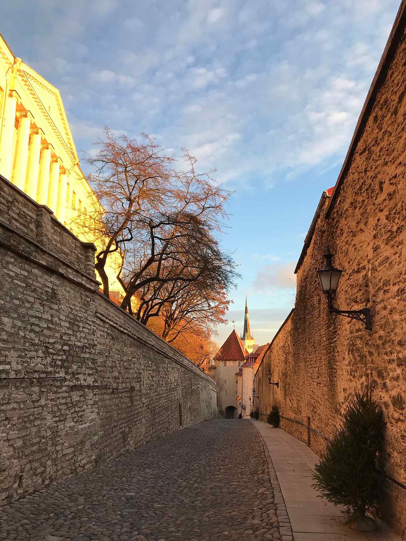 Pikk Jalg street in autumn, evoking the steep climb between Toompea and the Lower Town.