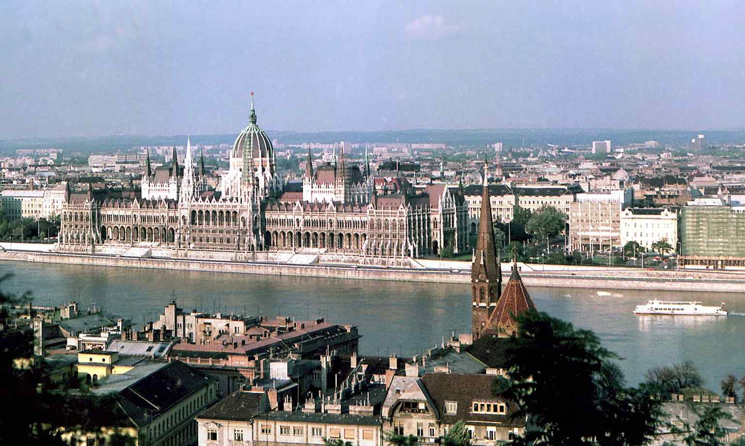 Enjoy the unique panorama of Budapest from the Bastion's lookout terraces, featuring the iconic Parliament building across the Danube.