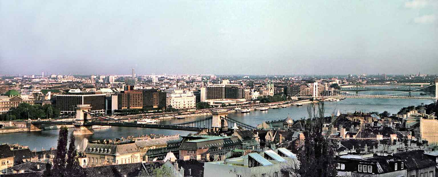 This view from the Fisherman's Bastion showcases the historic Chain Bridge spanning the Danube, connecting Buda and Pest.