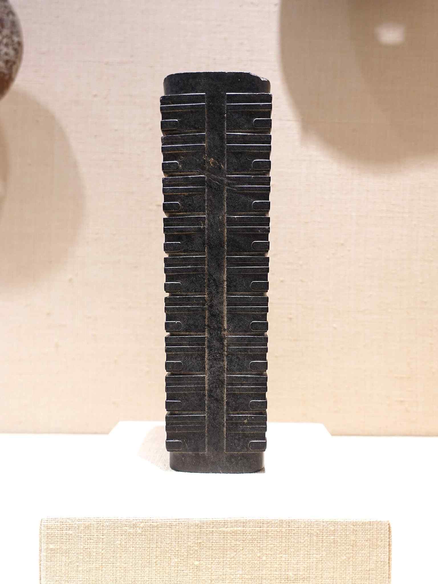 A Chinese jade cong, illustrating the Met’s encyclopedic Asian collection and its depth in ancient decorative arts.