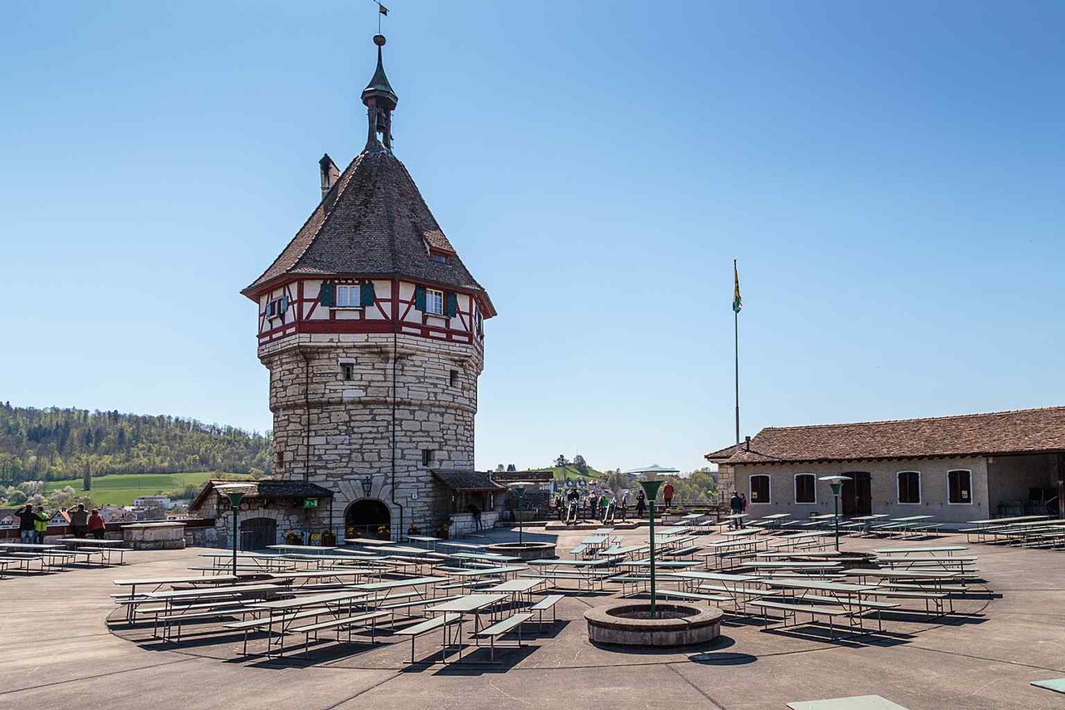 The upper platform and tower show the Munot’s circular defensive design and city-facing lookout position.