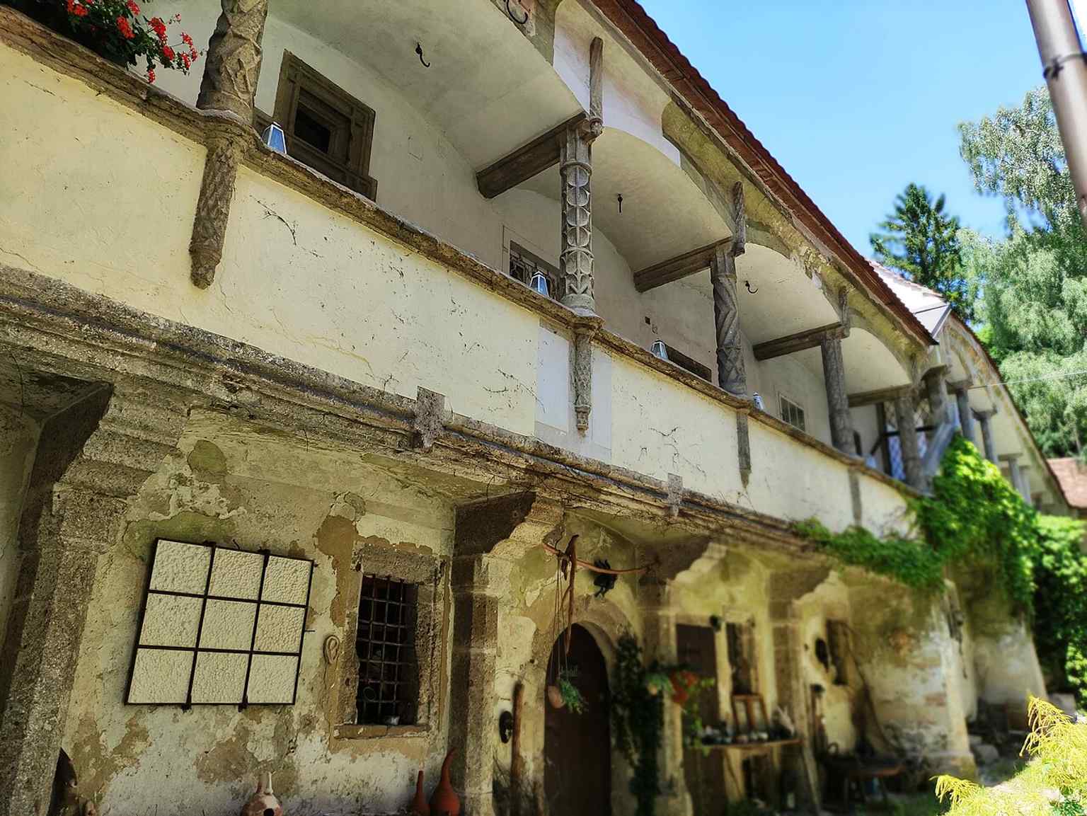 Another detailed view of the arcaded courtyard, useful for showing the preserved masonry and historic craftsmanship after the 1996 restoration.
