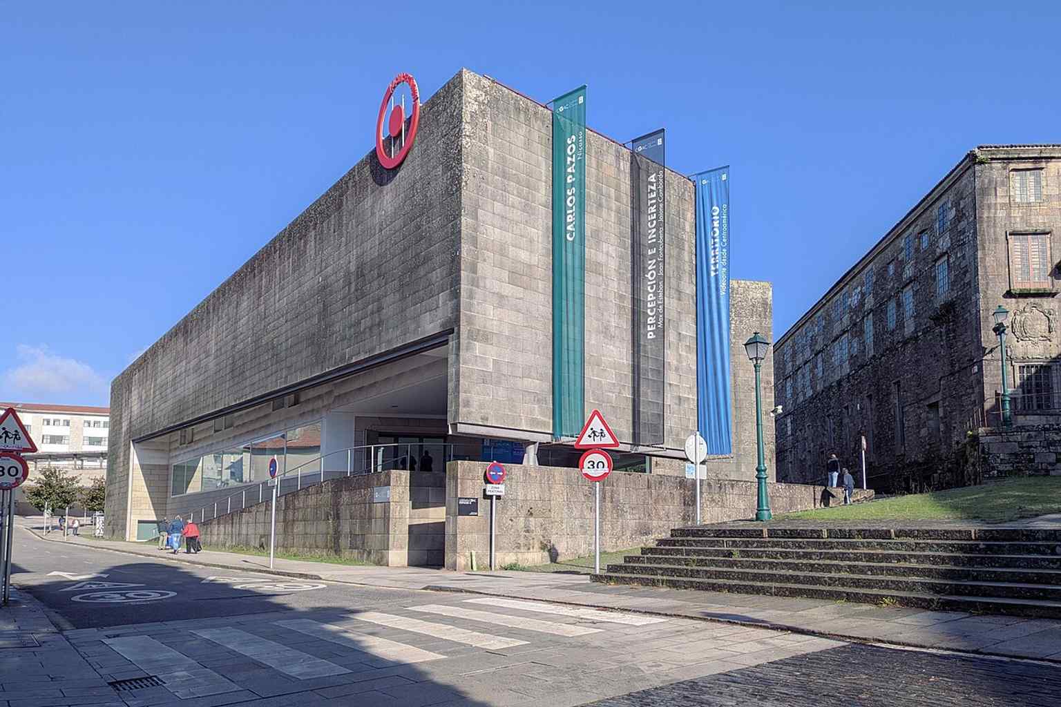 A view of the CGAC's granite facade, which famously suffered from 'granite sickness' just two years after its 1993 inauguration, causing the stone to darken and develop black spots due to Santiago's extreme humidity.