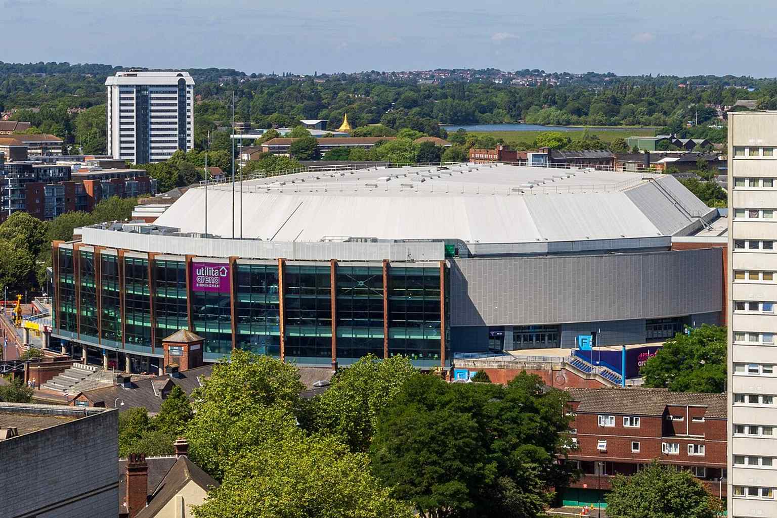 A recent high view from the Library of Birmingham, placing Arena Birmingham in the city skyline and showing its central location.