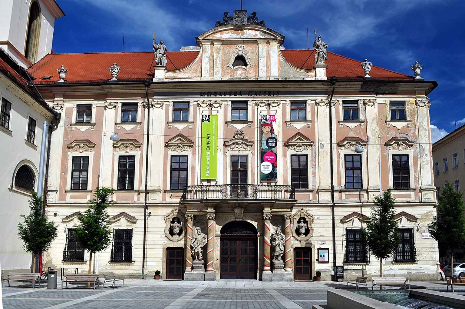A clear daytime view of the Governor’s Palace on Moravian Square, showing the baroque facade that now houses the Moravian Gallery.