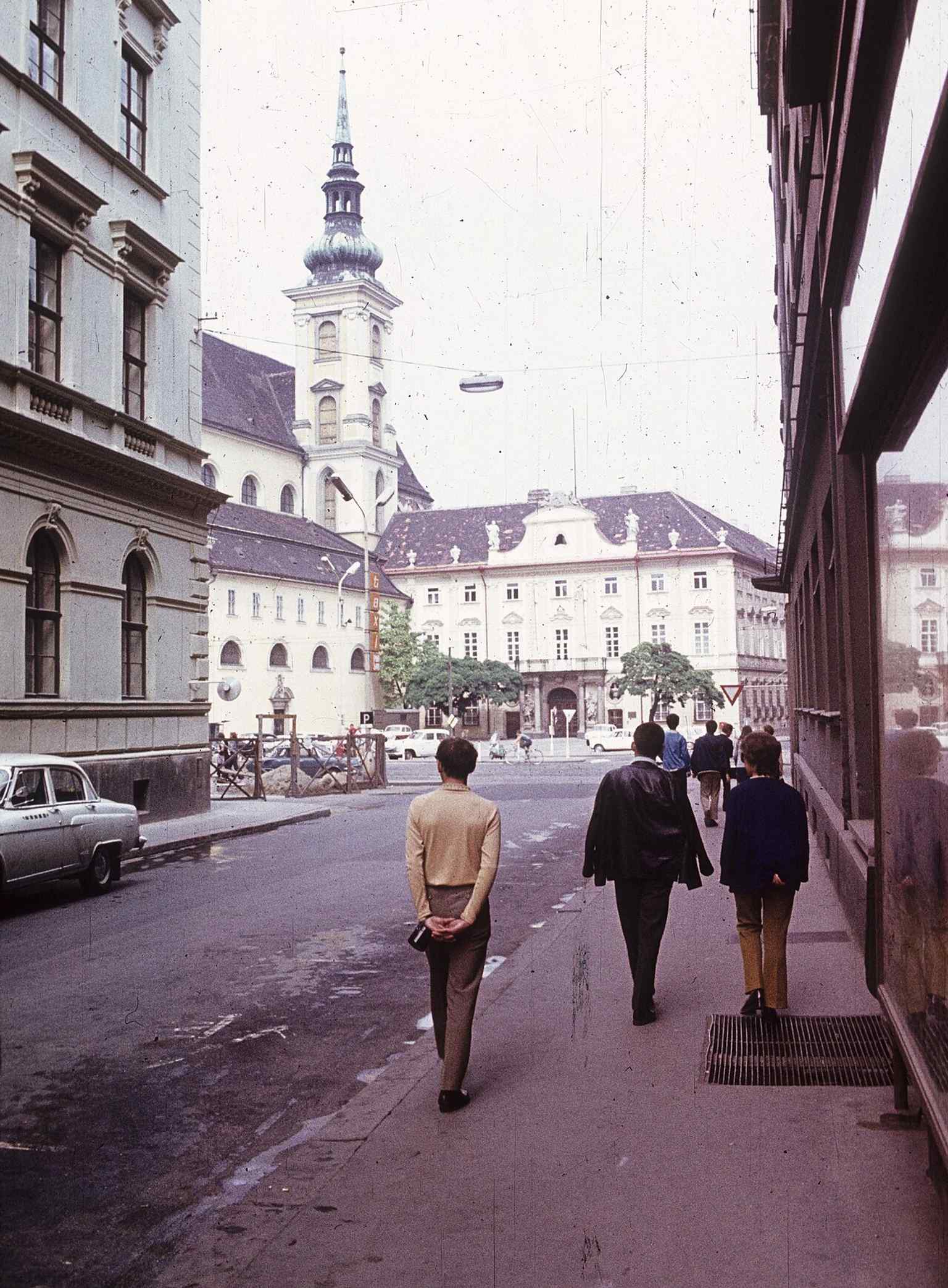 A 1975 view from Moravian Square showing the palace and St. Thomas Church together, the urban relationship that shaped the site for centuries.