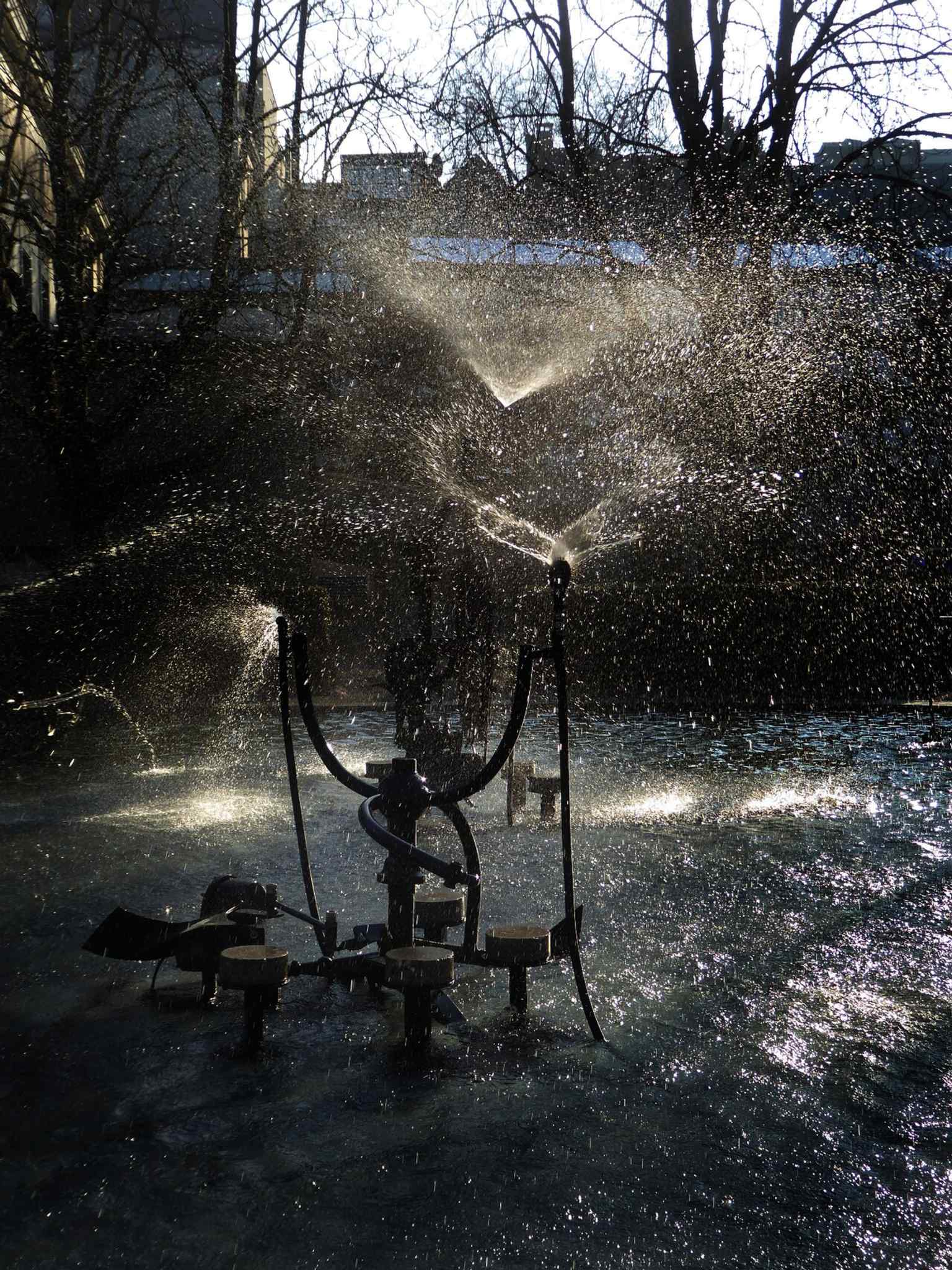 Another close composition from the sculpture series, showing the fountain as a permanent, urban continuation of carnival performance.