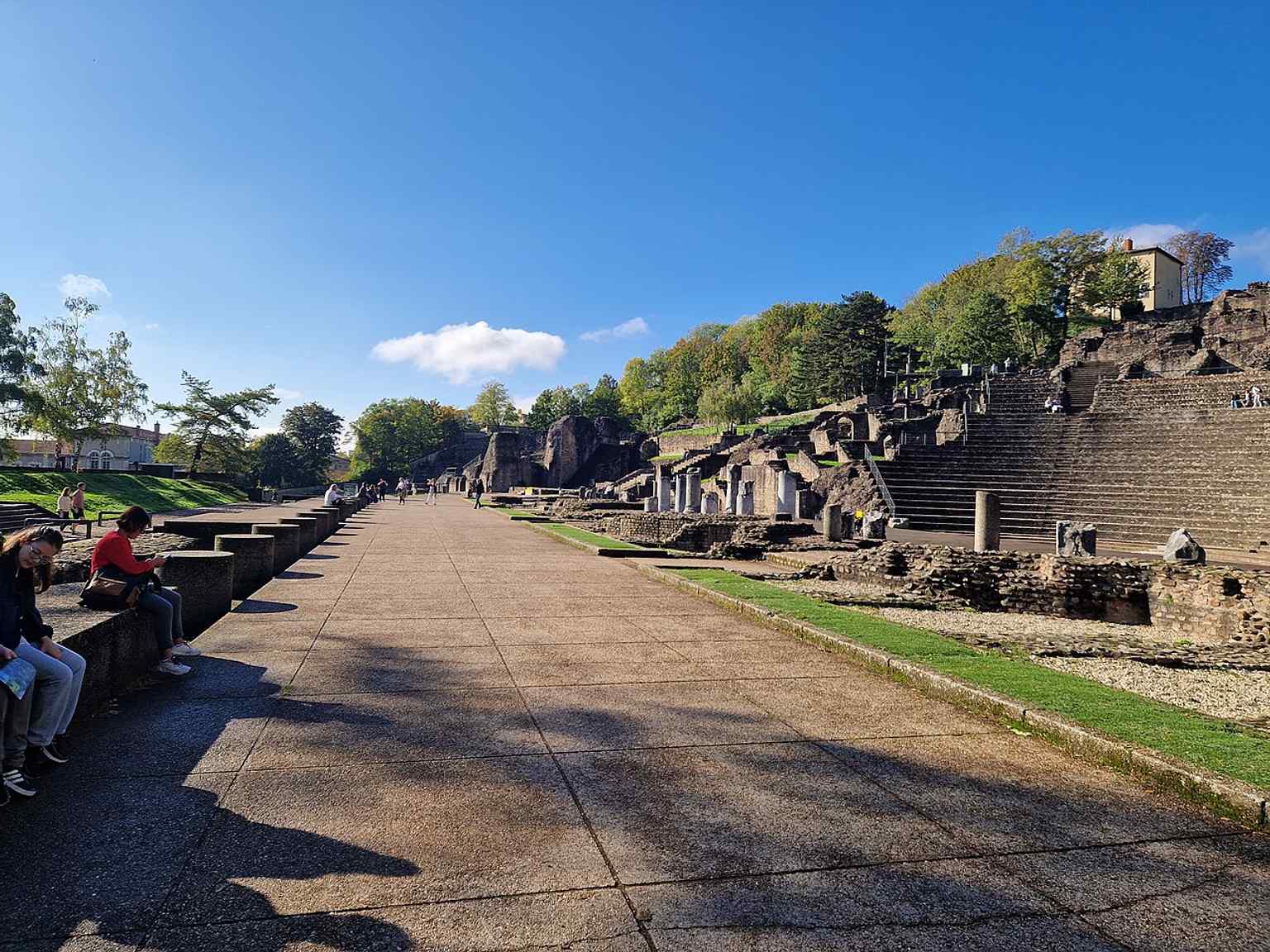 A rear view that includes both the theatre and the neighbouring Odeon, reflecting the archaeological ensemble described in the source text.