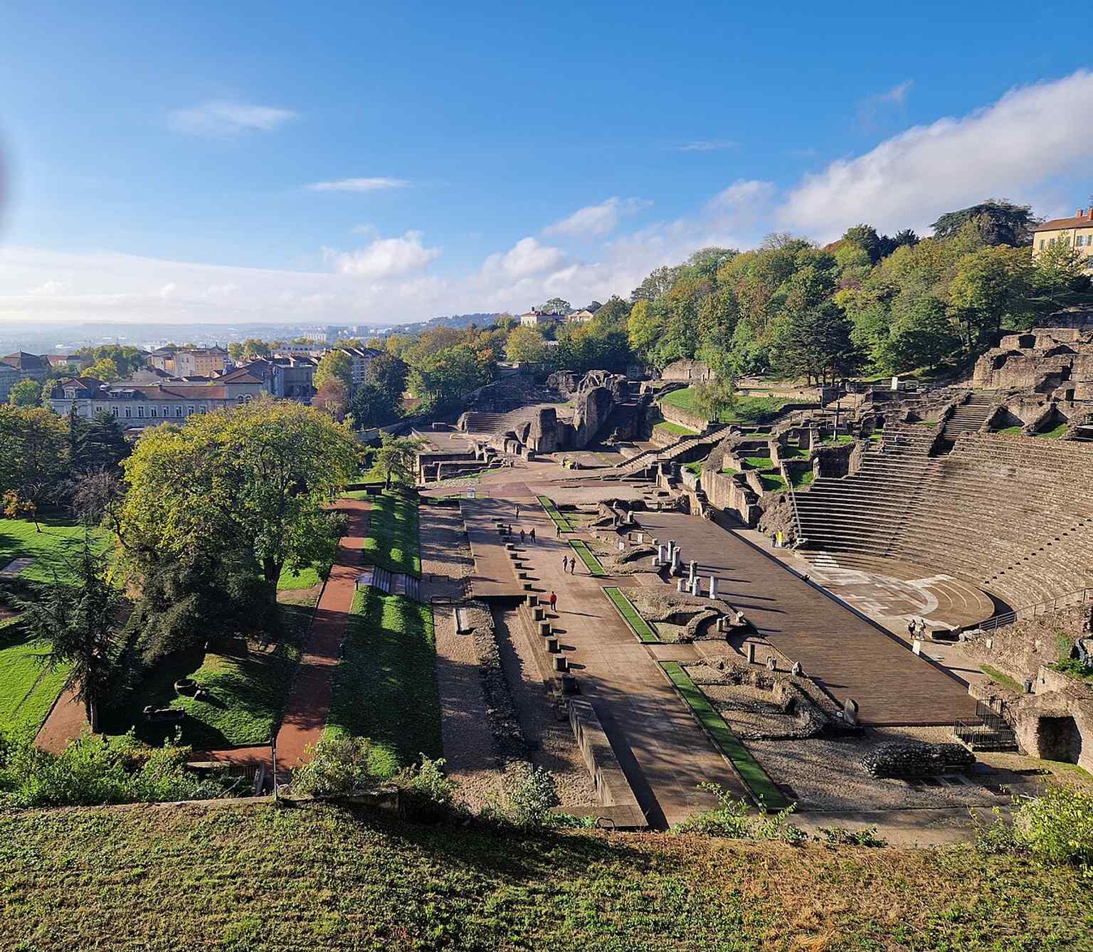 An elevated view of the theatre and Odeon together, illustrating the broader archaeological site of Fourvière that forms part of Roman Lyon.