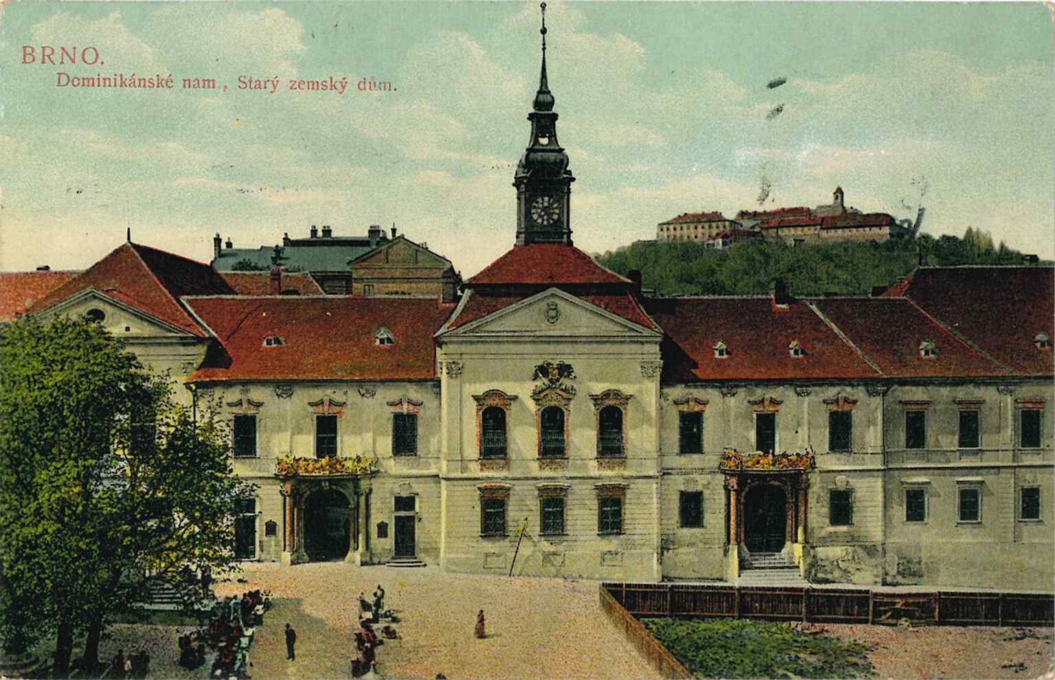 A 1908 postcard of the former ‘Land House’ before its modern municipal role, showing the historic complex on Dominikánské náměstí.