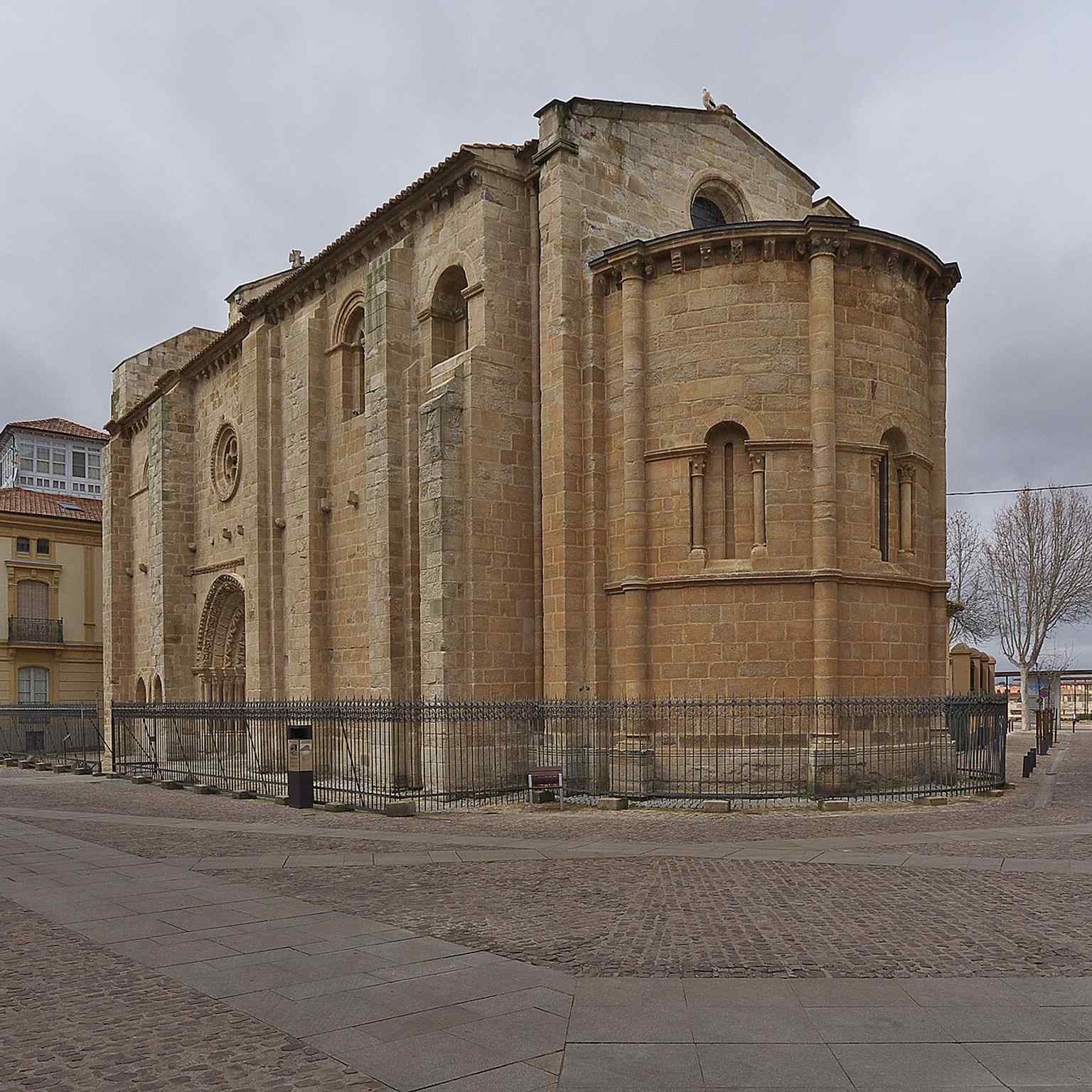 The church’s east end and apses show the Romanesque massing of a 12th-century building that took decades to complete.