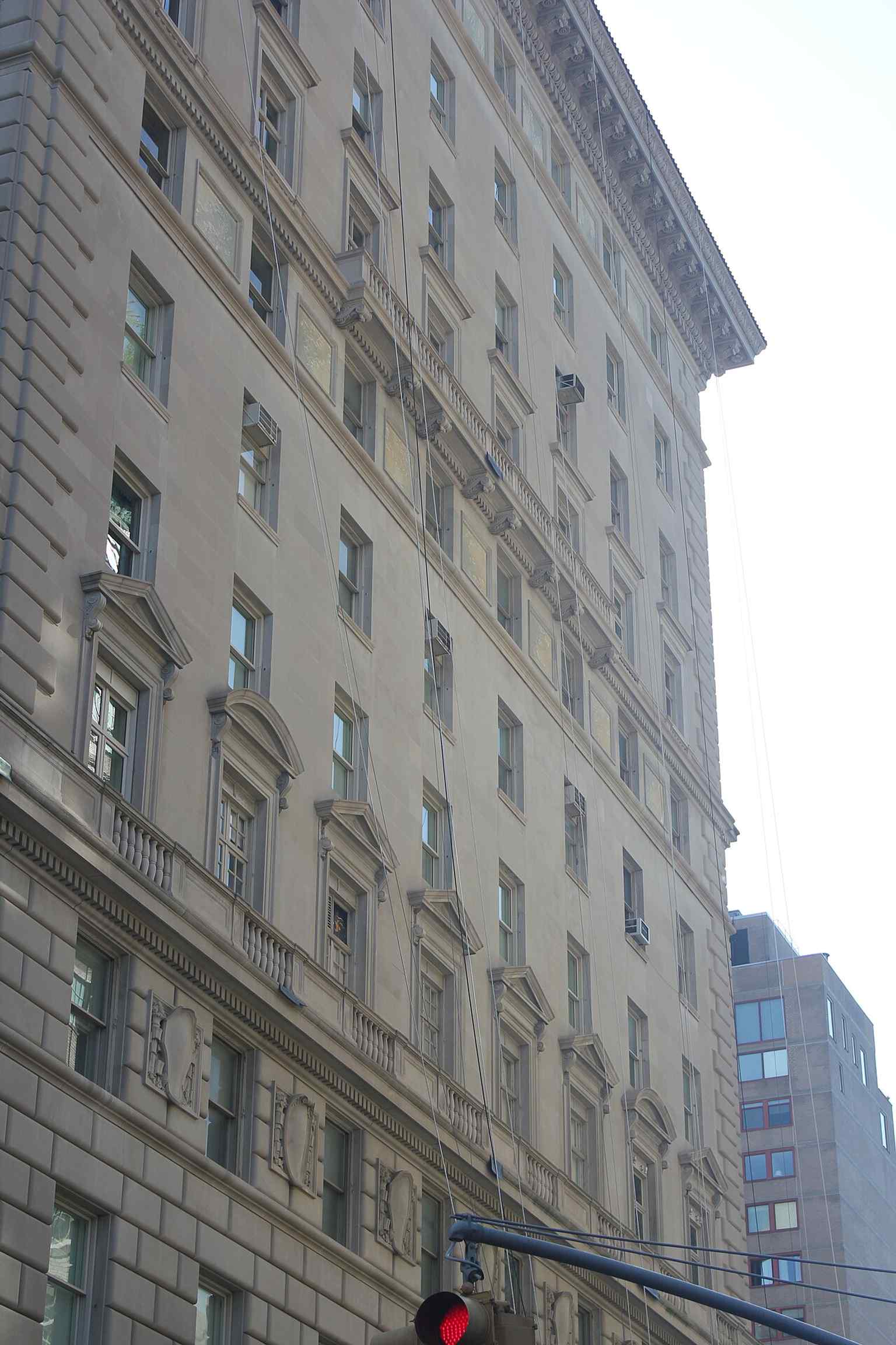 A focus on the balustrade stringcourses that visually define the divisions between the base, body, and top of the building's impressive design.