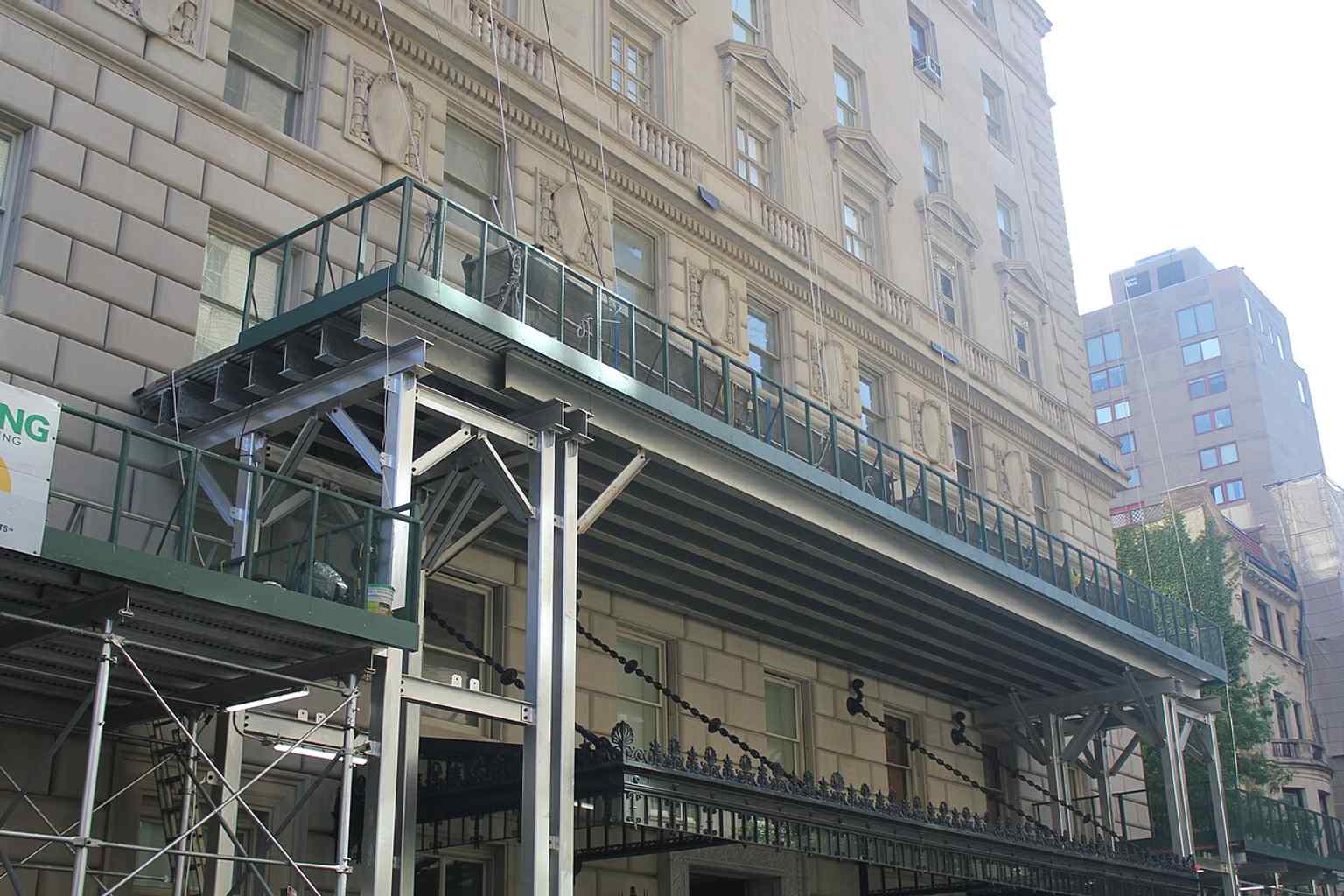 A detailed view of the building's heavily rusticated base and lower floors, a design feature reminiscent of Italian Renaissance palazzi.