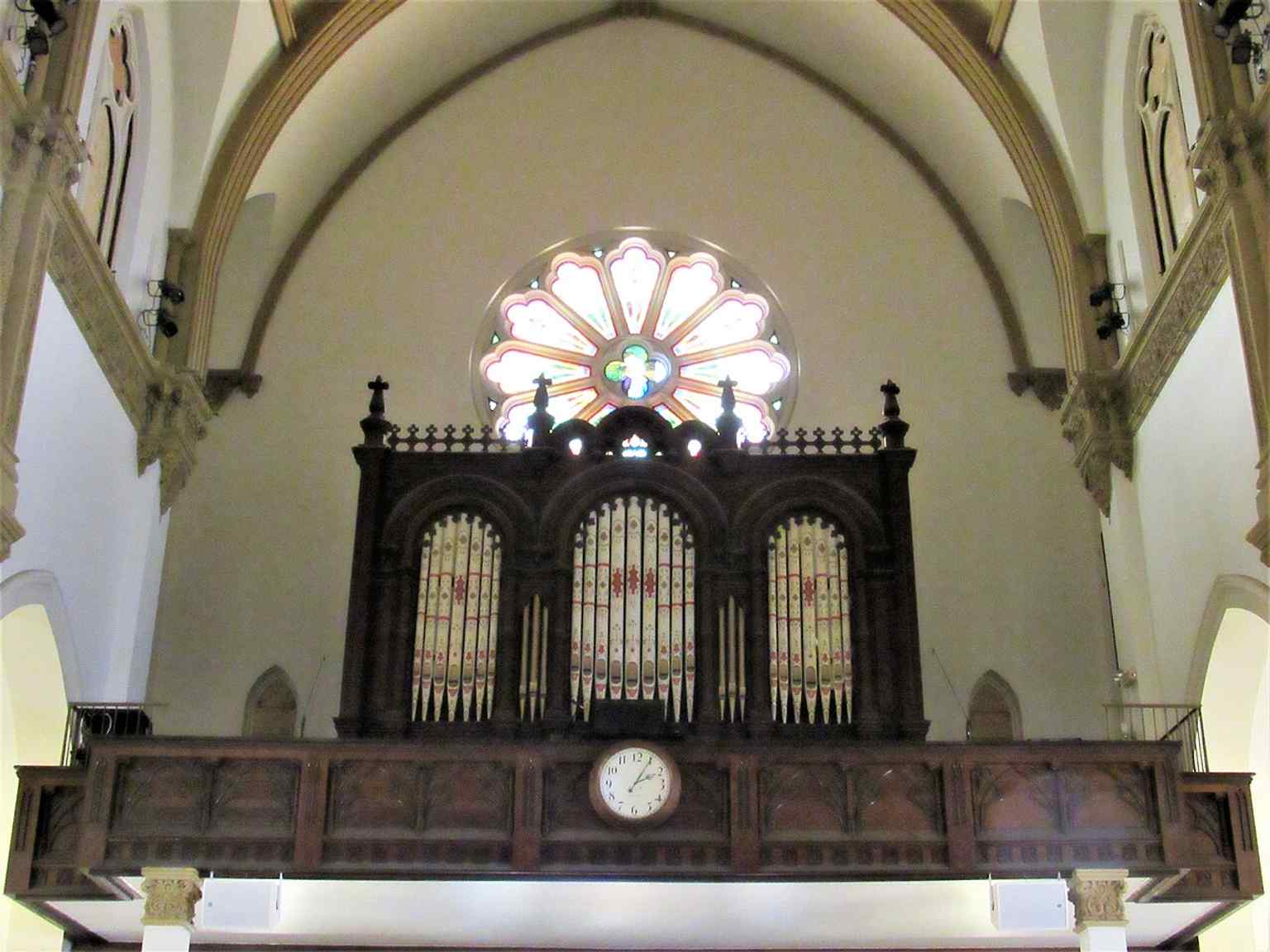 The pipe organ gallery, underscoring the cathedral’s role as both a worship space and a music venue.