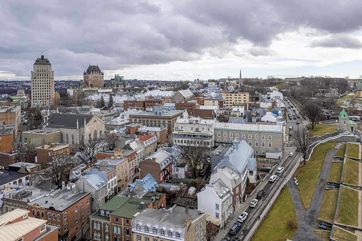 A sweeping aerial of Old Quebec showing the fortifications encircling the Upper Town, matching the site’s role as a city-wide defensive system.