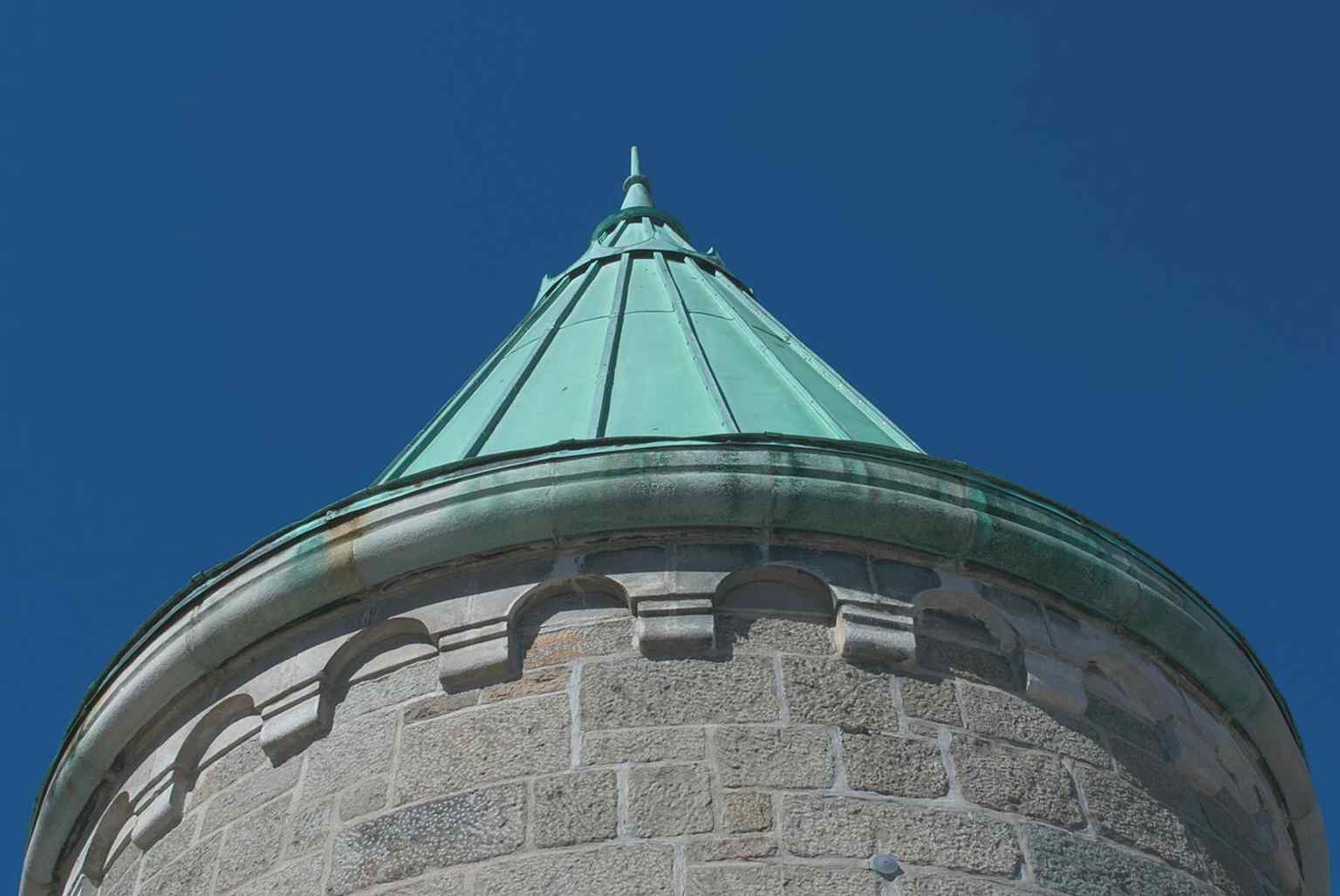 A close view of the Saint-Jean Gate tower, useful for highlighting the gate’s fortified architecture rather than just its street façade.
