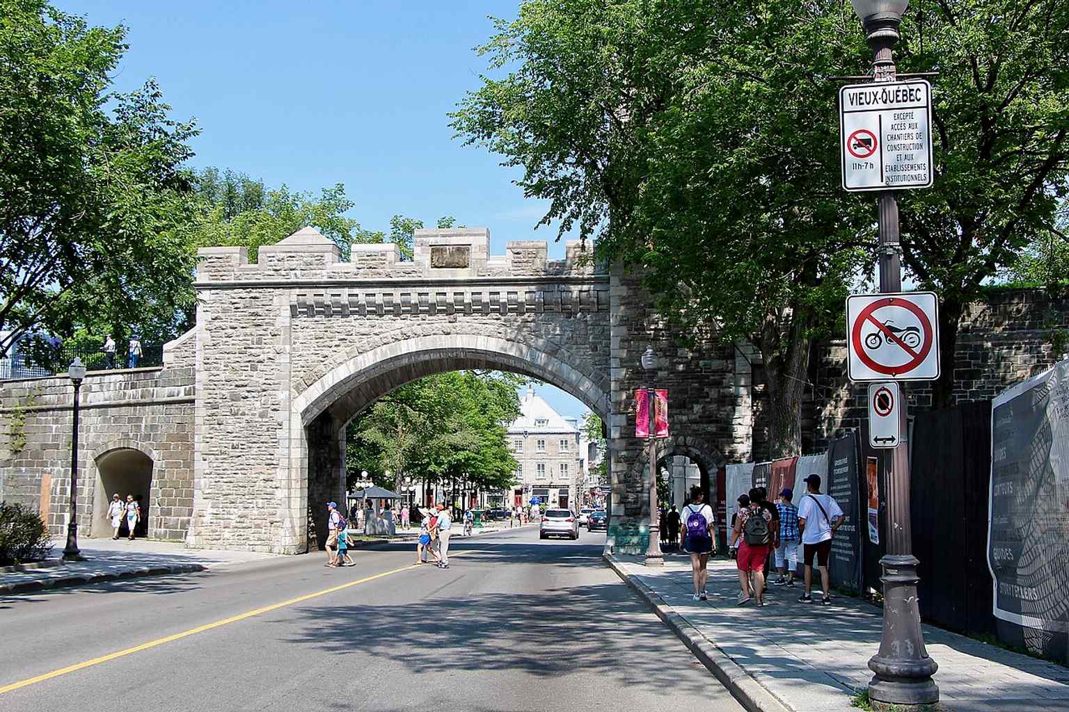 Saint-Louis Gate on St. Louis Street highlights the rebuilt city gates that replaced the older, narrower openings demolished in 1871.
