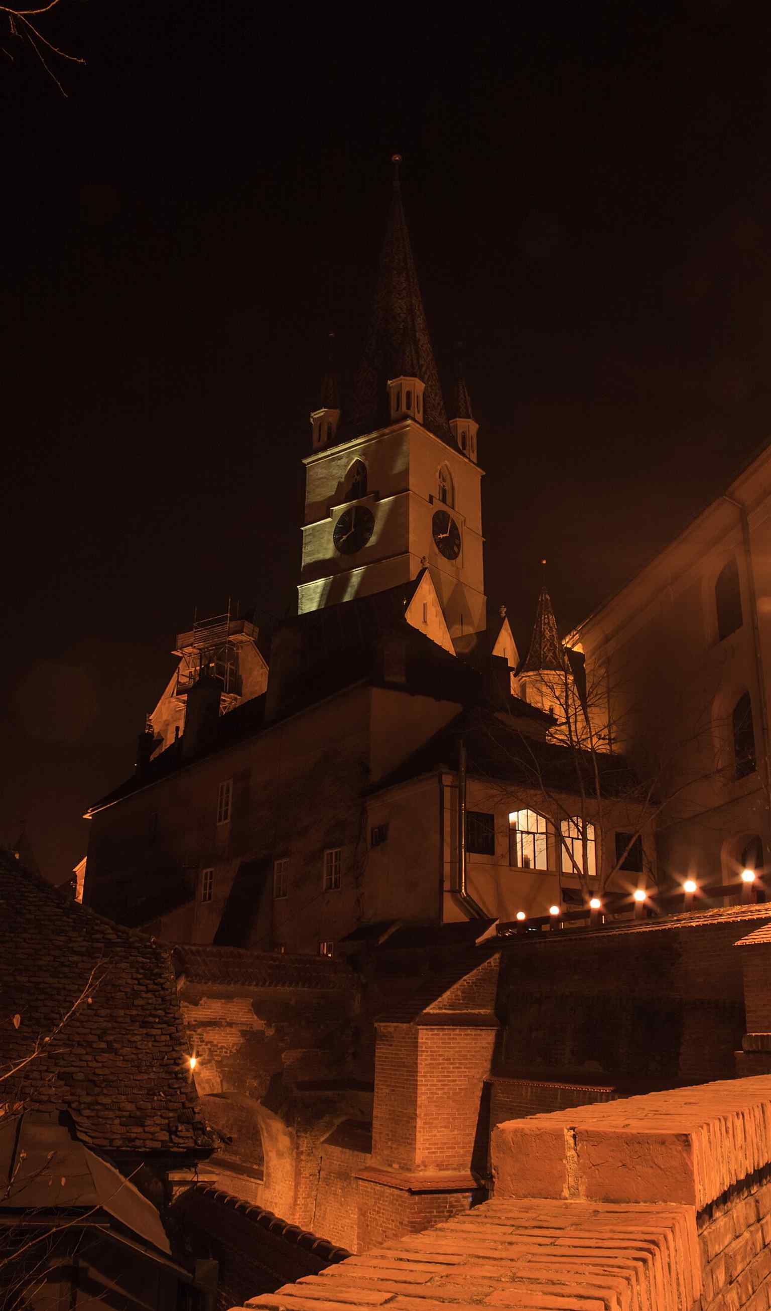 The cathedral's impressive 7-level tower, topped with four turrets, historically symbolized Sibiu's right to impose capital punishment and served as a fire lookout.
