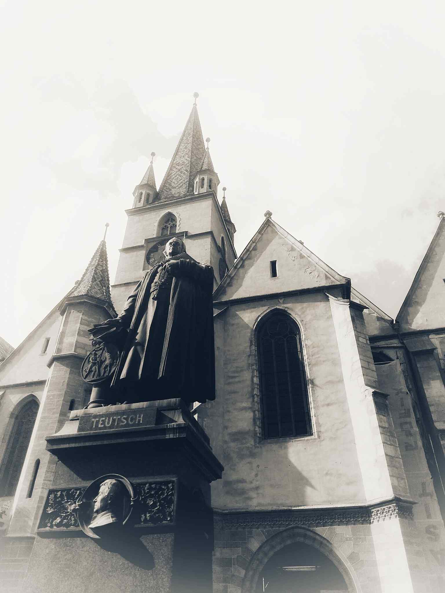 This statue honors Bishop Georg Daniel Teutsch (1817-1893), whose monument was erected in front of the cathedral in 1899.