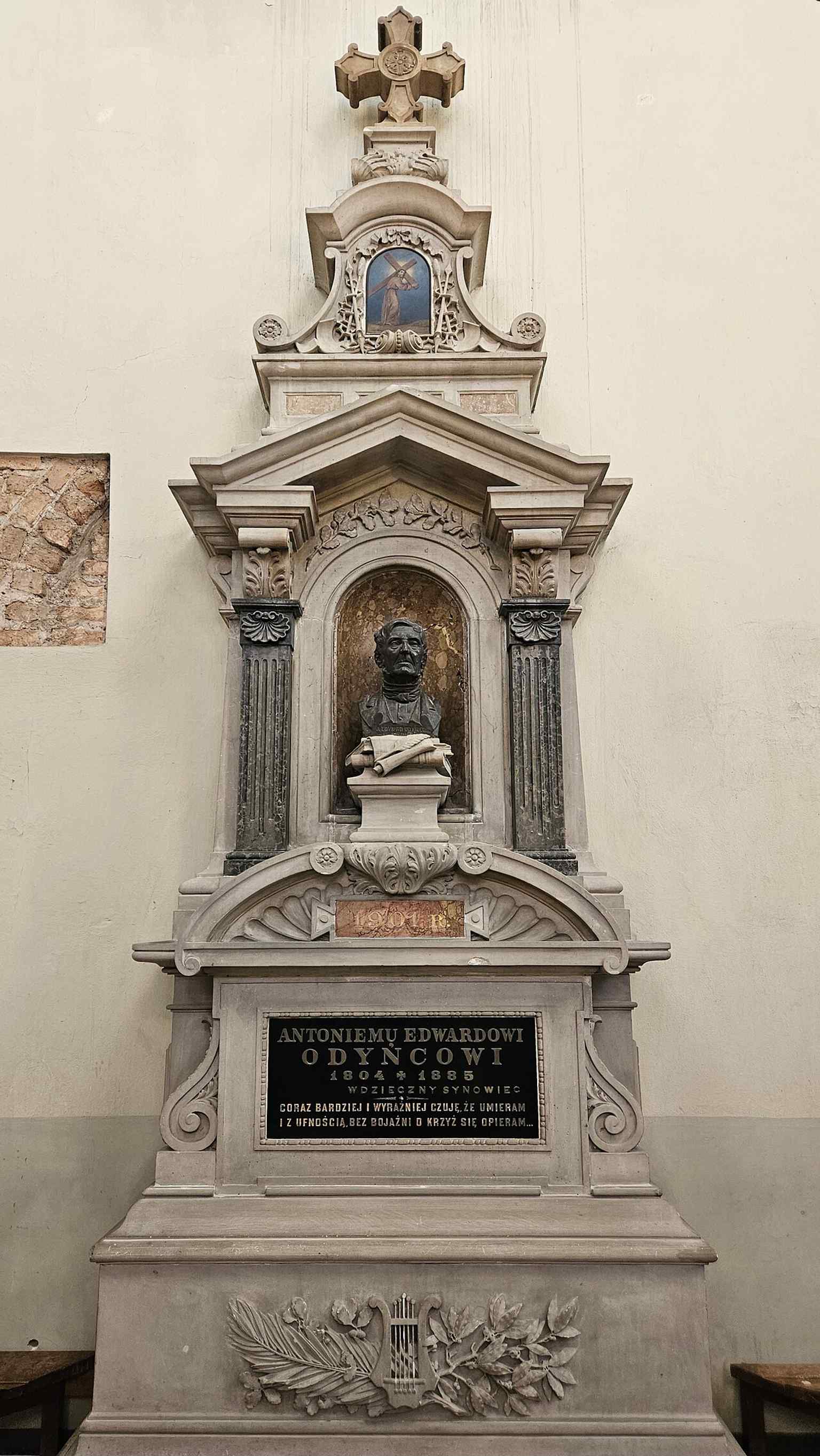 A memorial monument inside the church, one of several commemorations that turned St. John’s into a historic archive of Vilnius intellectual and religious life.