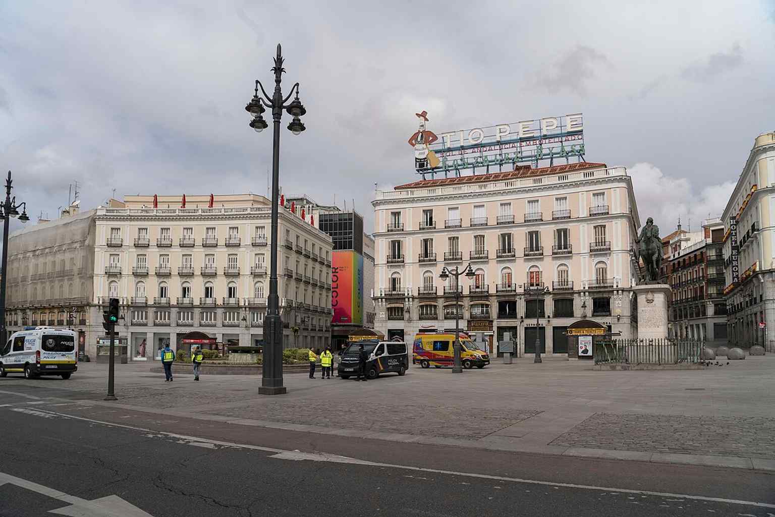 An unusually empty Puerta del Sol during the COVID-19 lockdown, highlighting how exceptional silence can feel in this normally crowded crossroads.