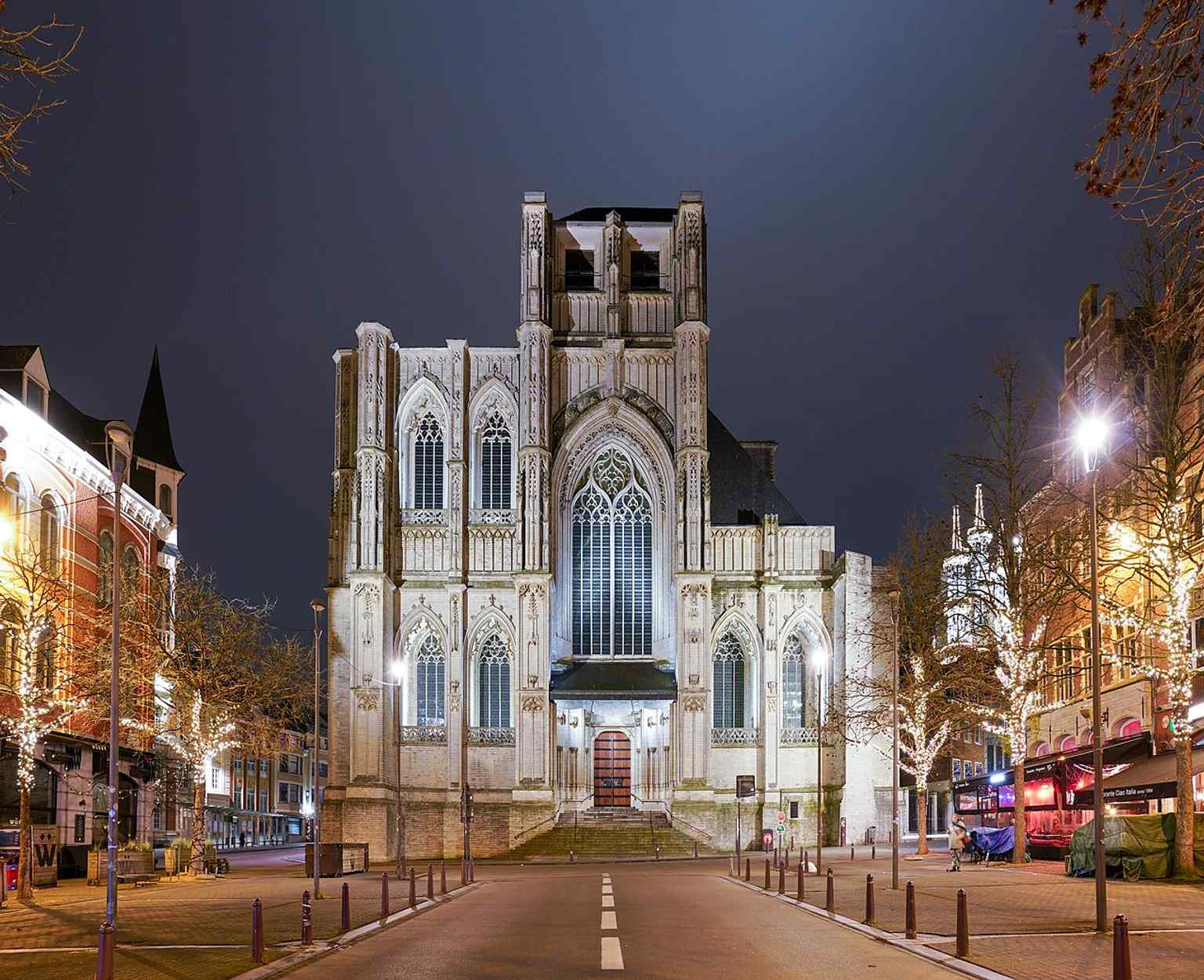 A crisp modern view of St. Peter’s Church, showing the Brabantine Gothic massing and the famously unfinished west towers.