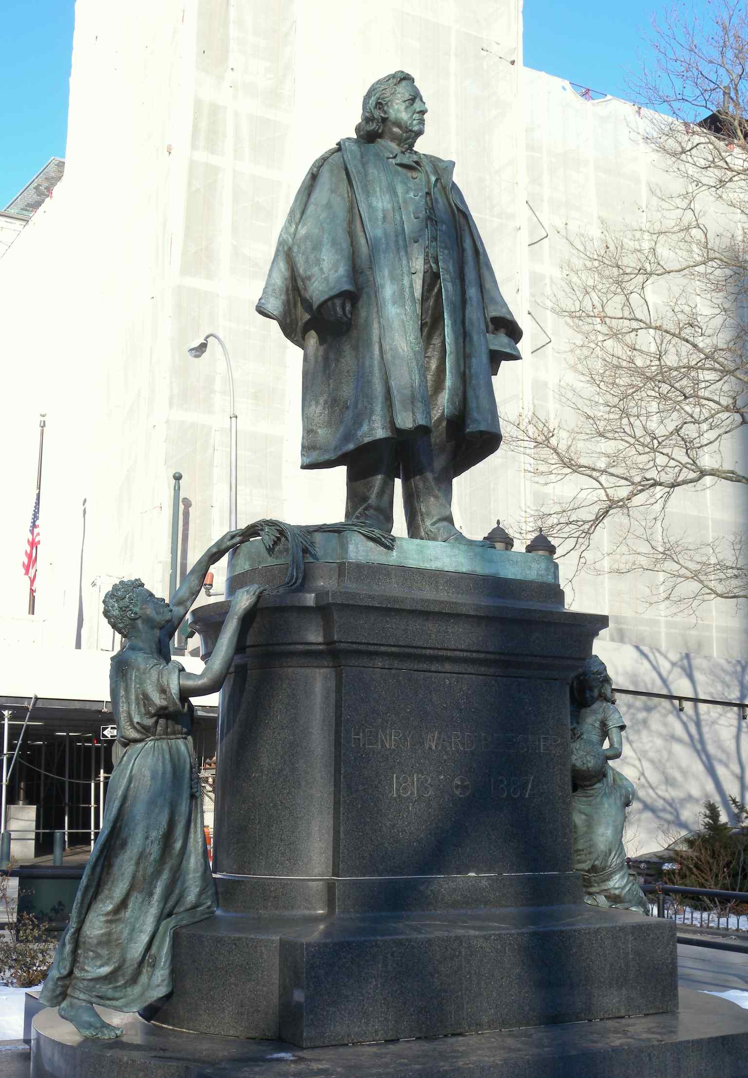 This full view captures the Henry Ward Beecher Monument in Cadman Plaza, featuring the main figure of Beecher alongside the symbolic Black female figure and children below.