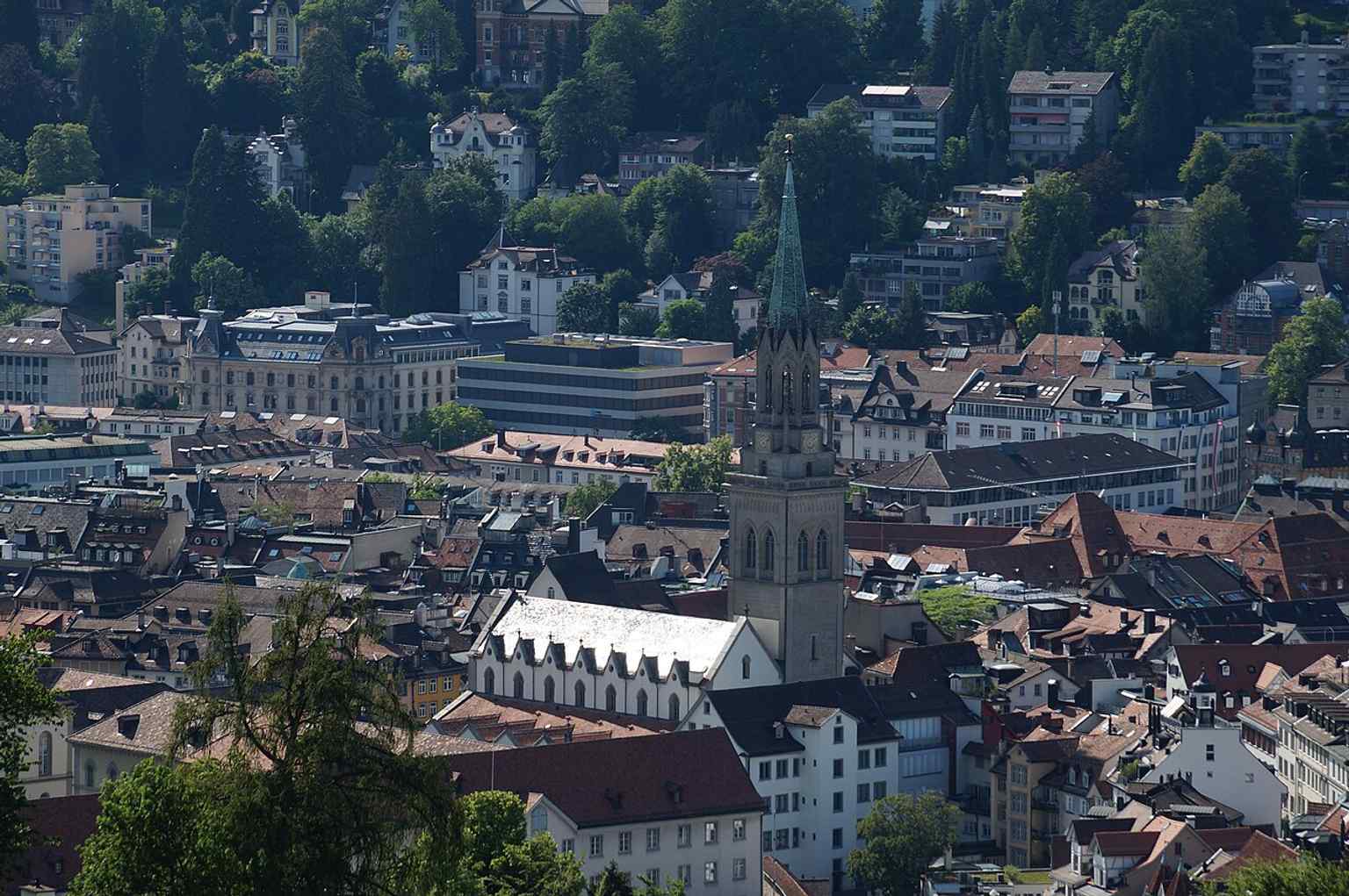 A distant elevated view from Drei Weieren, placing St. Laurenzen in the broader St. Gallen landscape and showing how prominent the tower is.