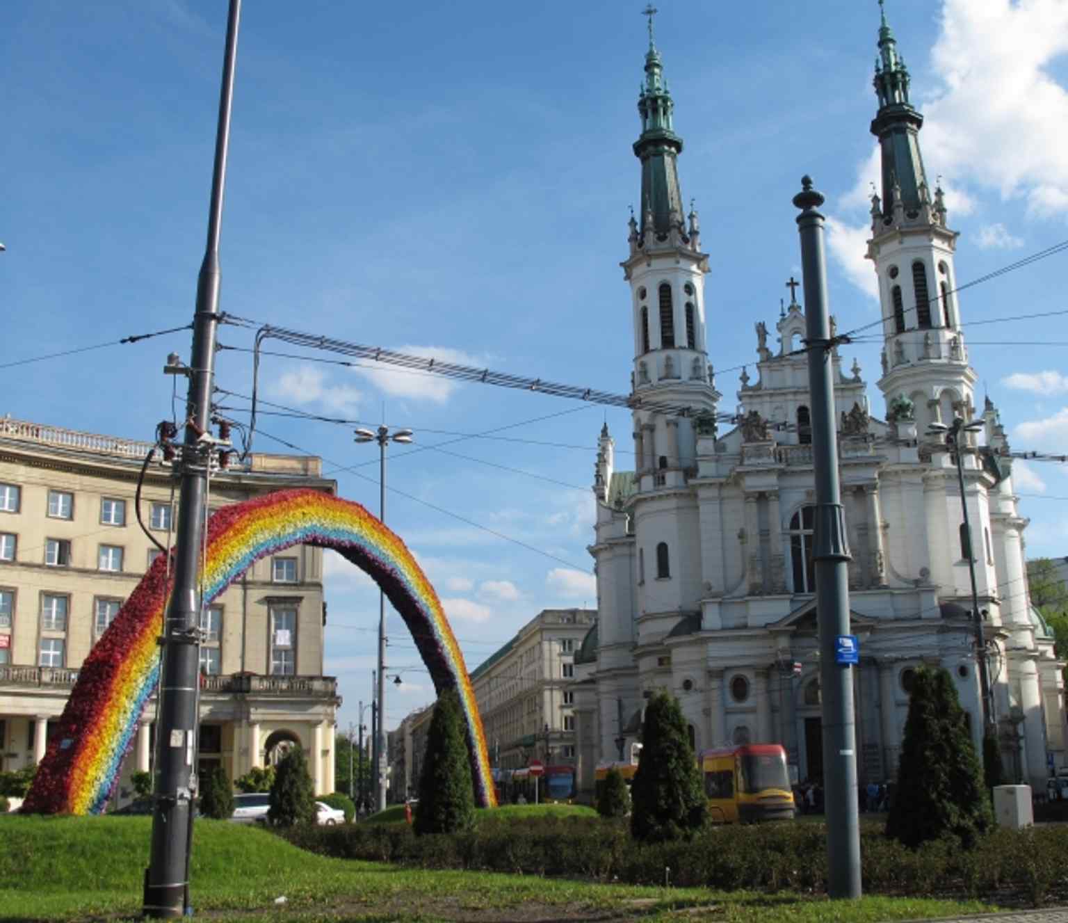 Plac Zbawiciela with the Church of the Holiest Saviour and the Rainbow together in 2015 — the square where art, religion, and politics collided.