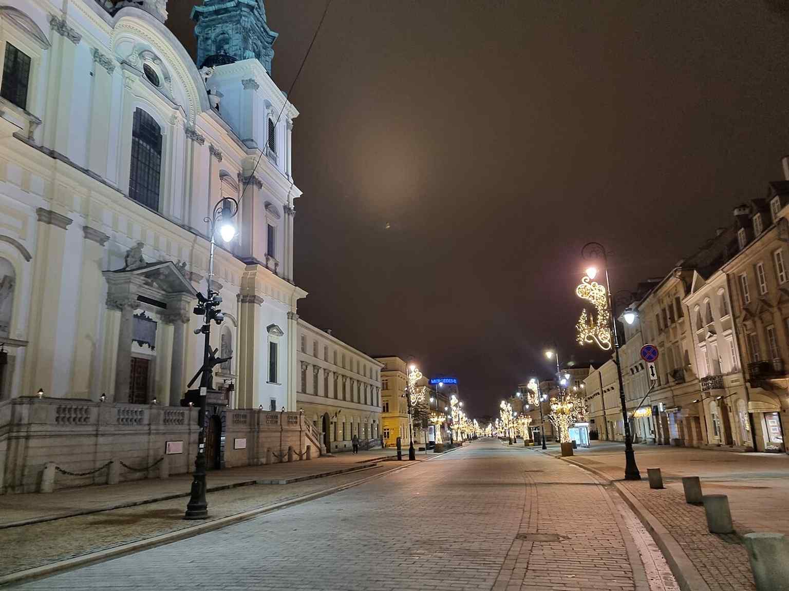 A recent open-street view of Nowy Świat, showing its pedestrian-friendly character after the 1996 narrowing of the roadway.