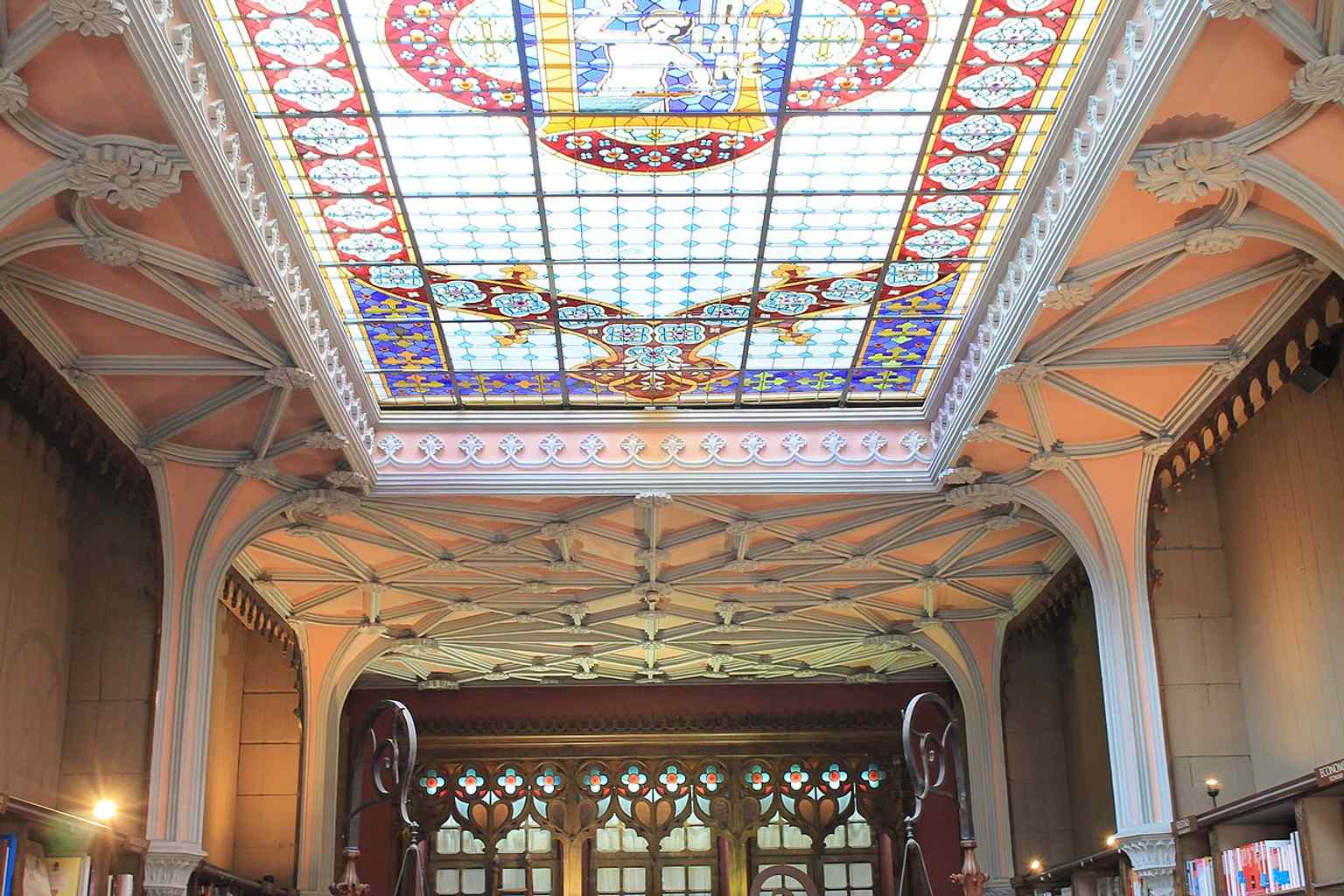 The restored glass ceiling and surrounding windows, tying directly to the landmark 2016 conservation work on the rooftop vitral.