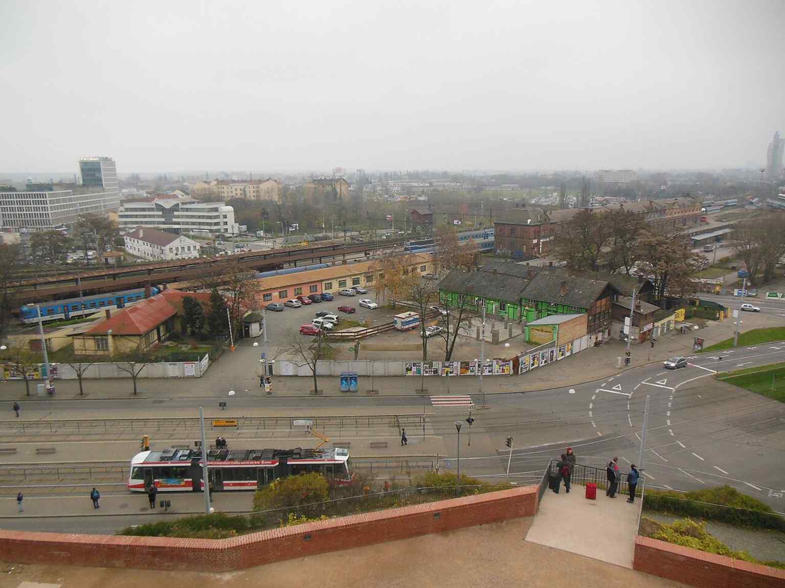 A panoramic look from Denis’s Gardens toward Nádražní Street — the park’s serpentine paths connect this terrace with the city below.