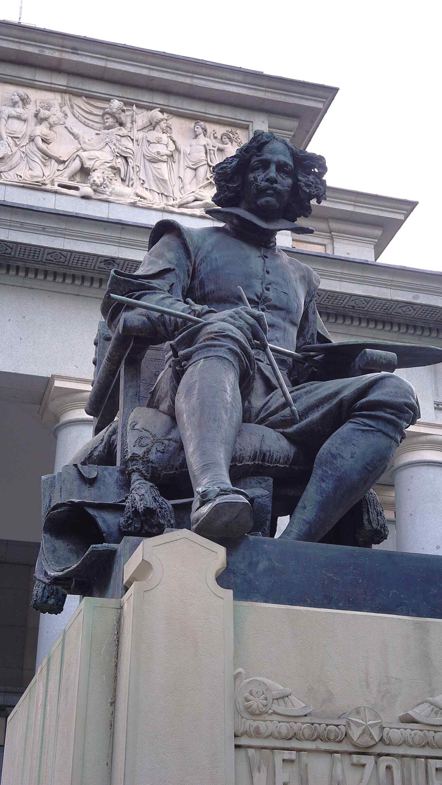 Velázquez stands at the main entrance, a 1899 monument that honors the painter most closely associated with the Prado's collection.