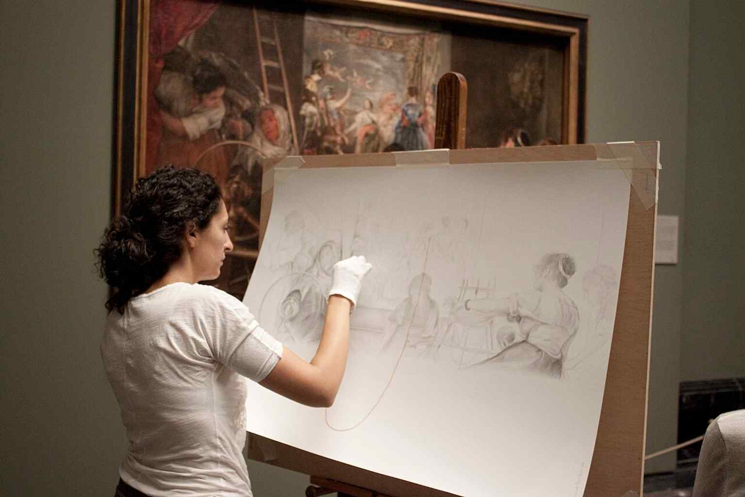 A contemporary artist copying Las Hilanderas in the galleries, a reminder that the Prado has long functioned as a school for painters.