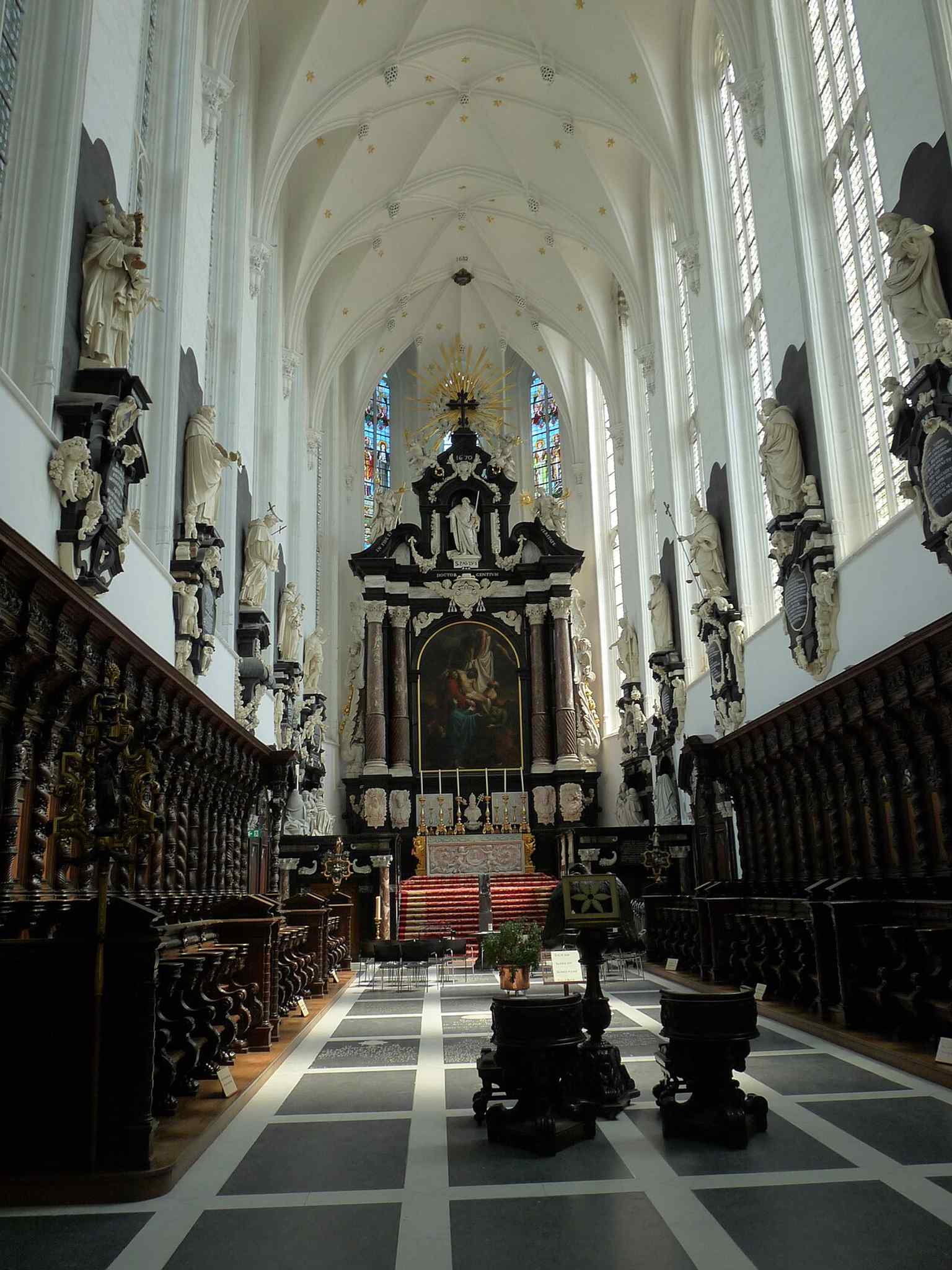 A broad interior view that captures the church’s richly decorated Baroque nave, one of the best examples of Flemish Baroque church design in Antwerp.