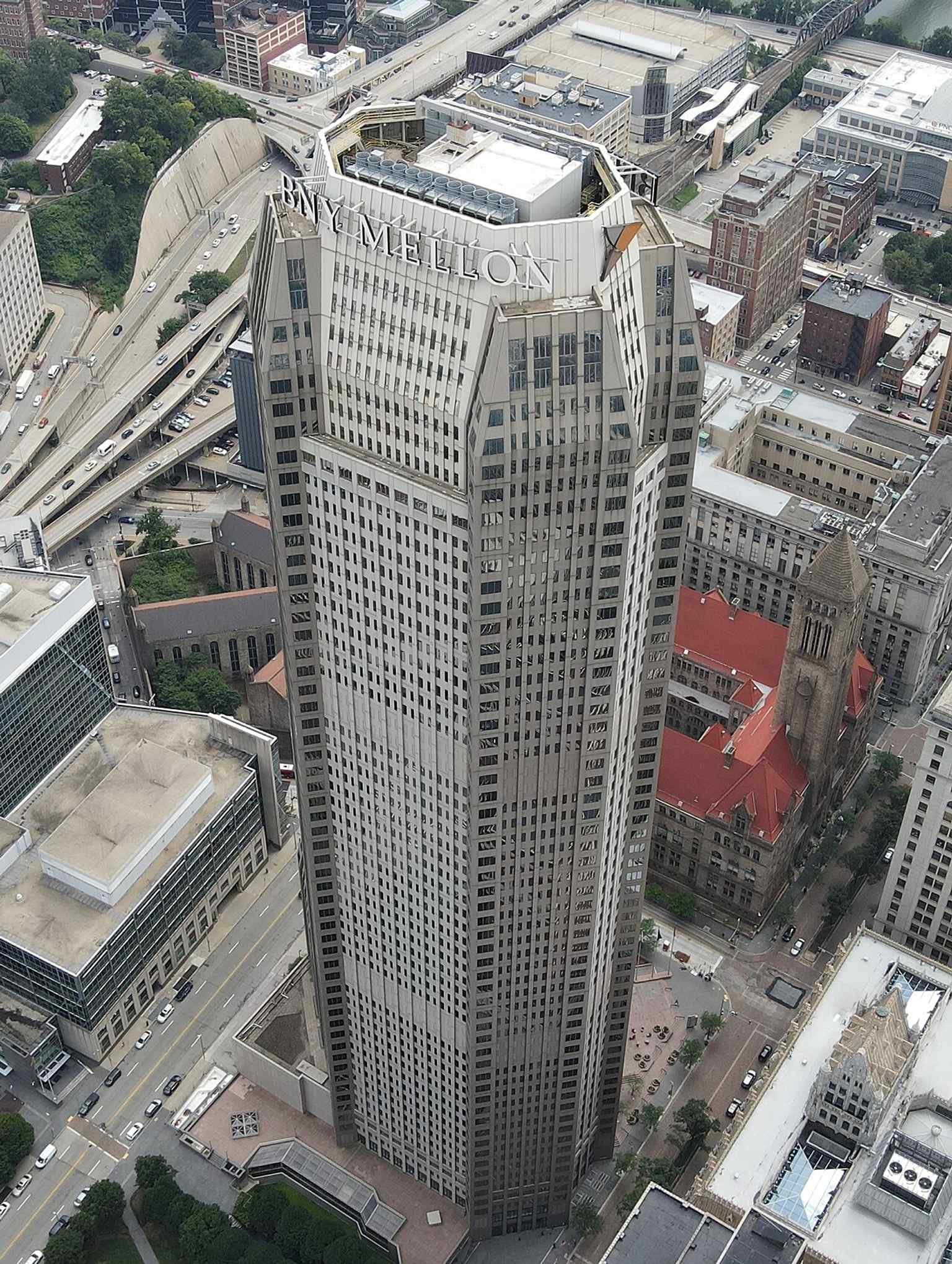 An aerial perspective of Downtown Pittsburgh, with the red-roofed Allegheny County Courthouse visible in the background, showing its prominent position on Grant's Hill.