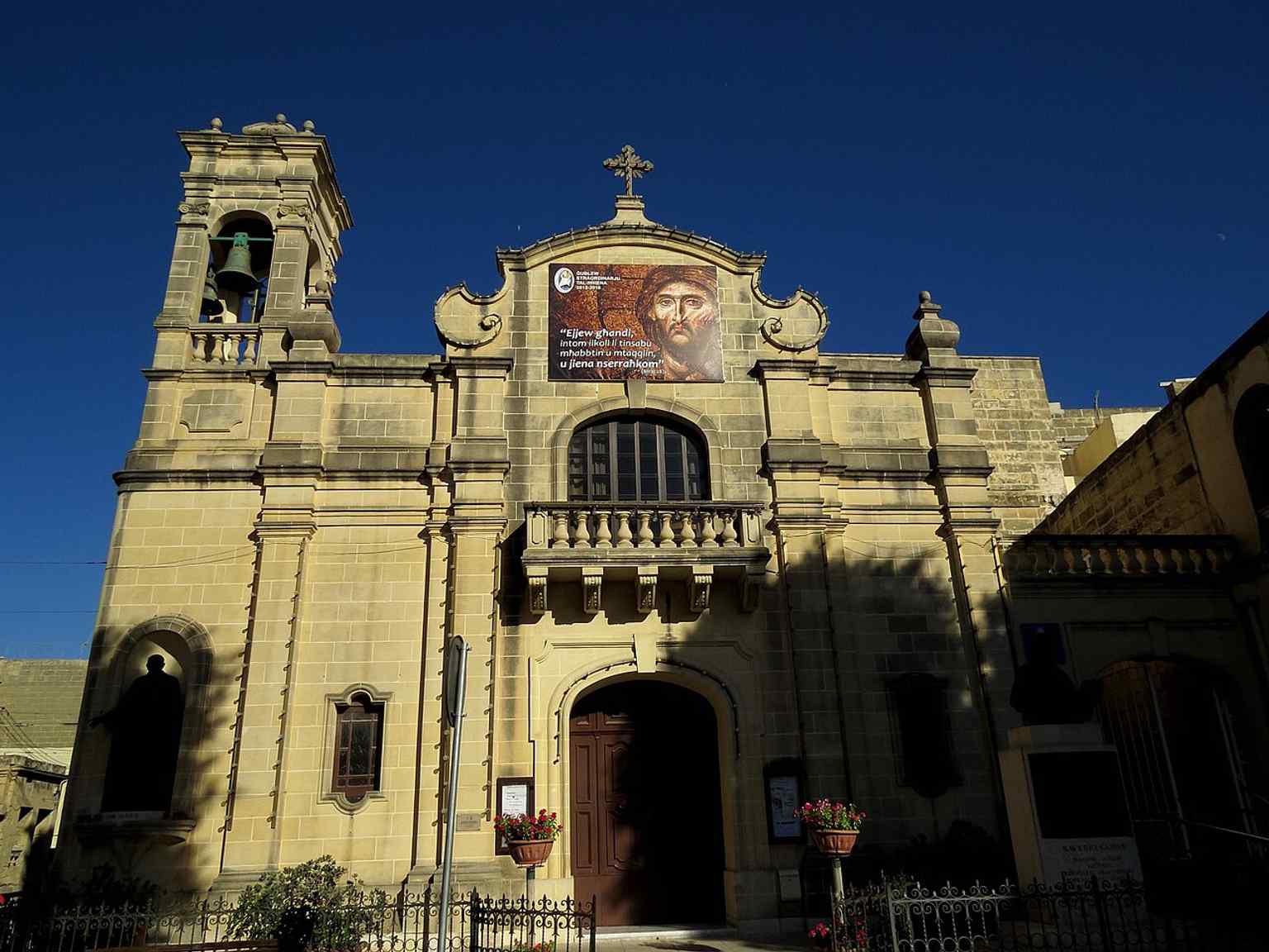 Street-level view of St James in Victoria, the small town church that stands in Independence Square and remains a living parish center.