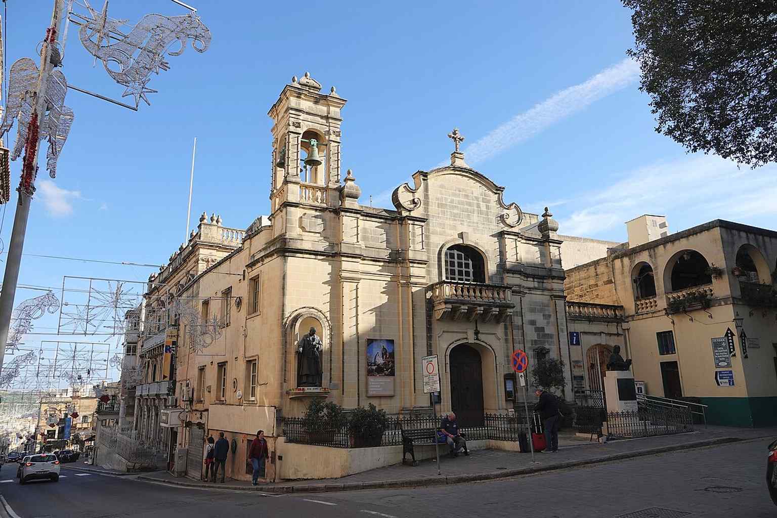 A clear modern exterior of Church of St James, the rebuilt church whose history includes damage, reconstruction, and continued use for the feast of Our Lady of Sorrows.