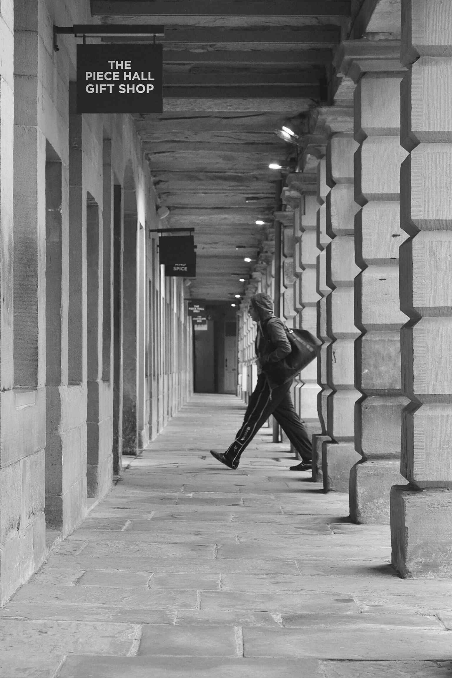 Walking through the North Cloisters reveals the covered galleries around the courtyard, part of the hall’s distinctive enclosed market layout.